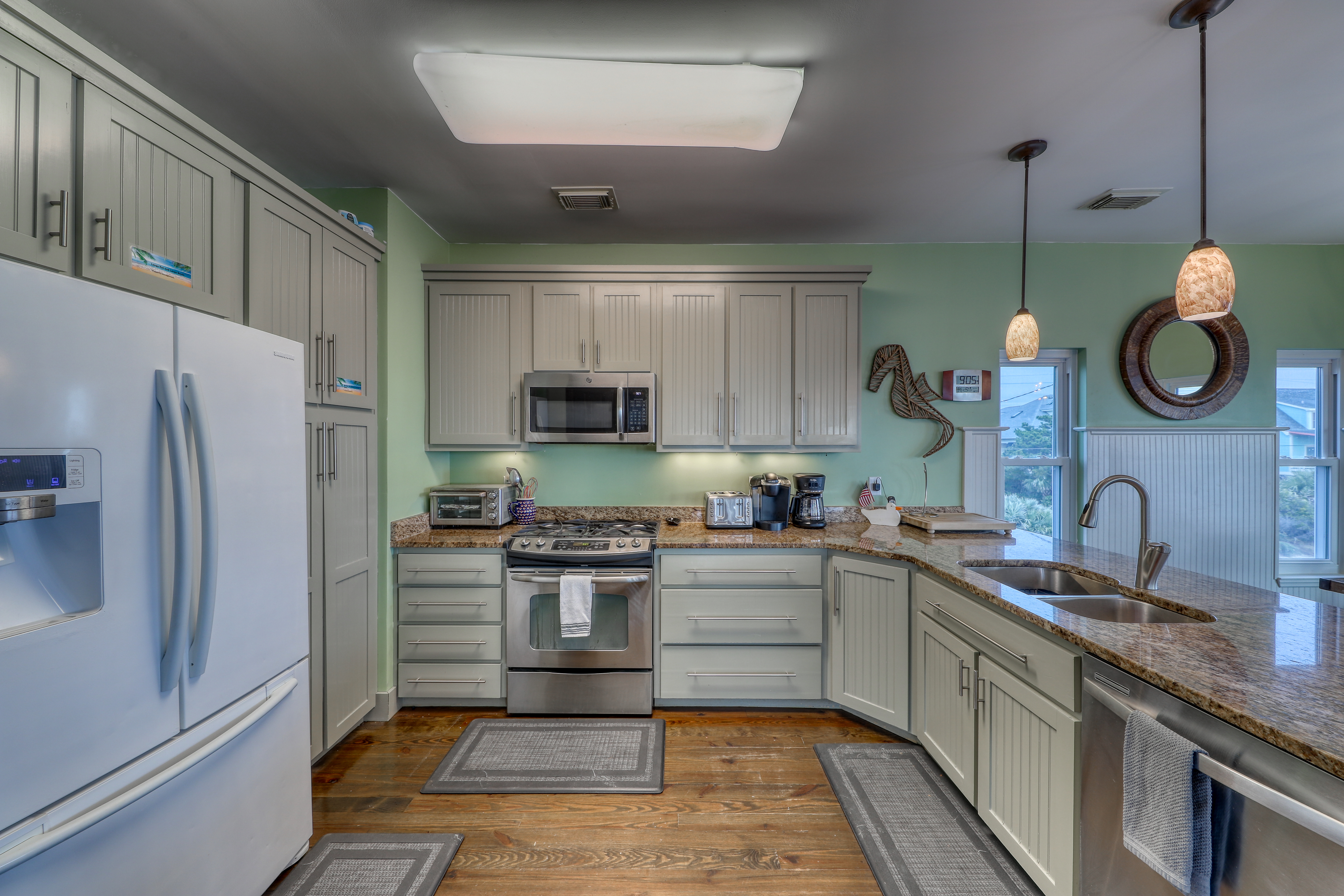 Raised oceanfront home with elevator & outdoor shower just steps from beach