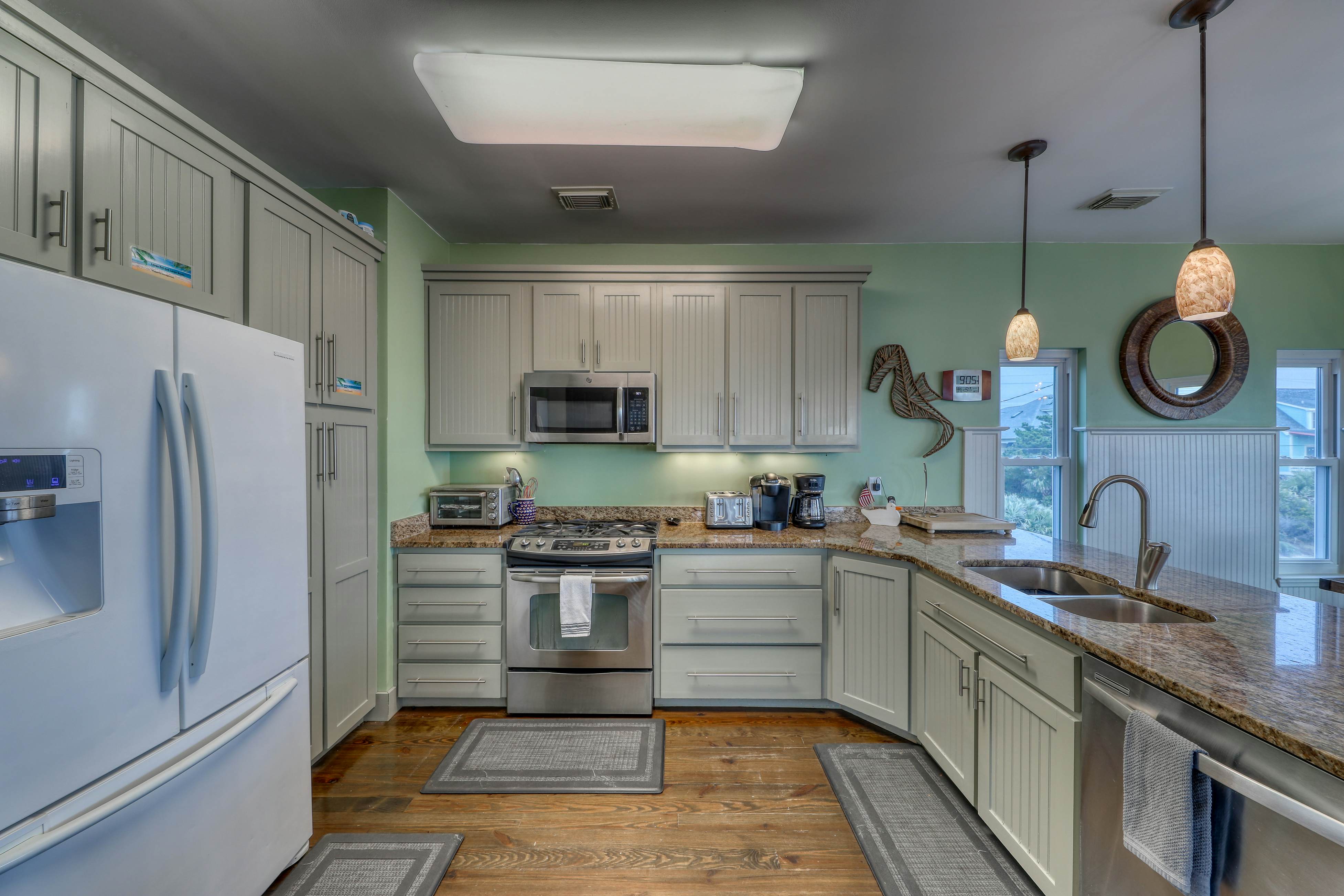 Raised oceanfront home with elevator & outdoor shower just steps from beach