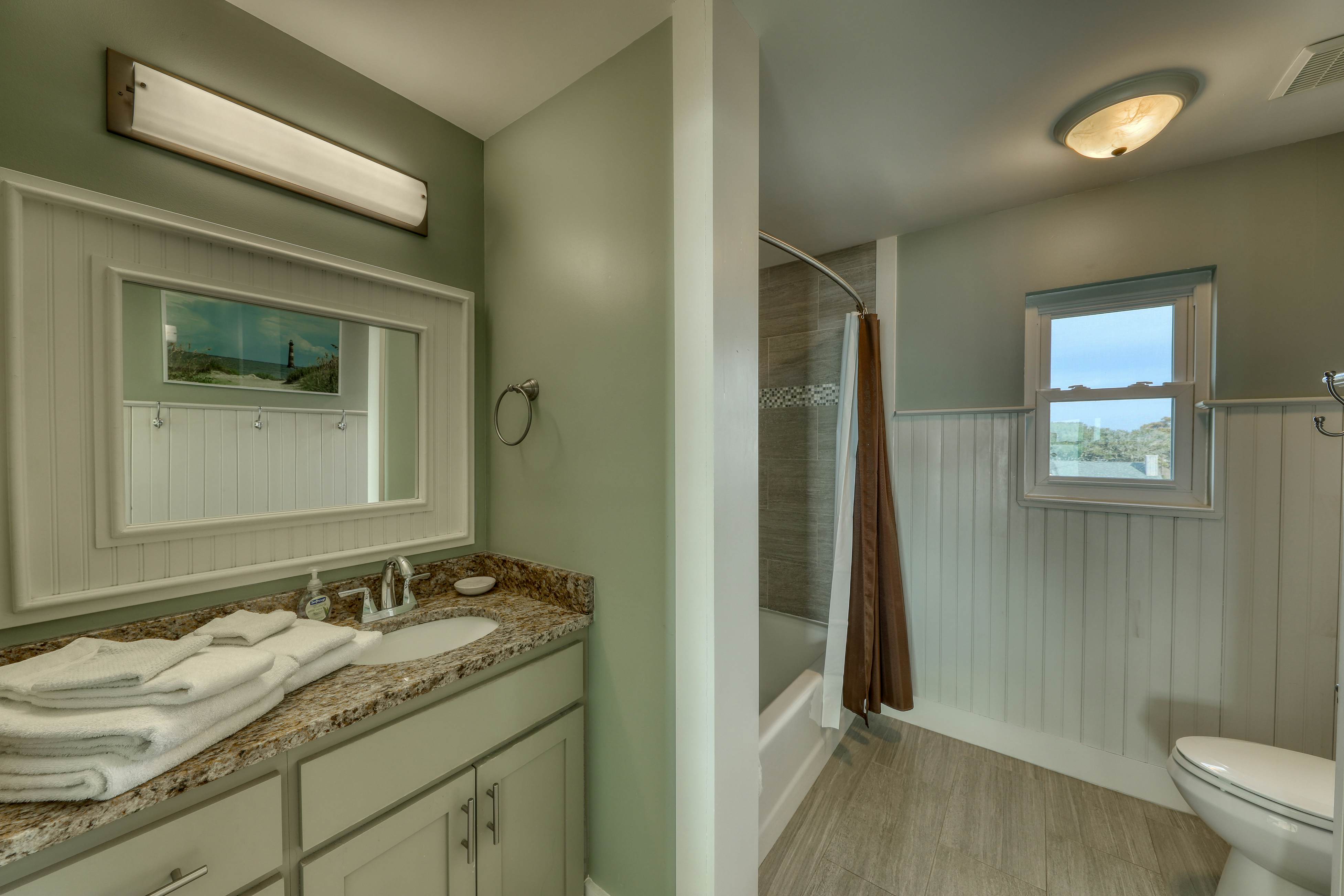 Raised oceanfront home with elevator & outdoor shower just steps from beach