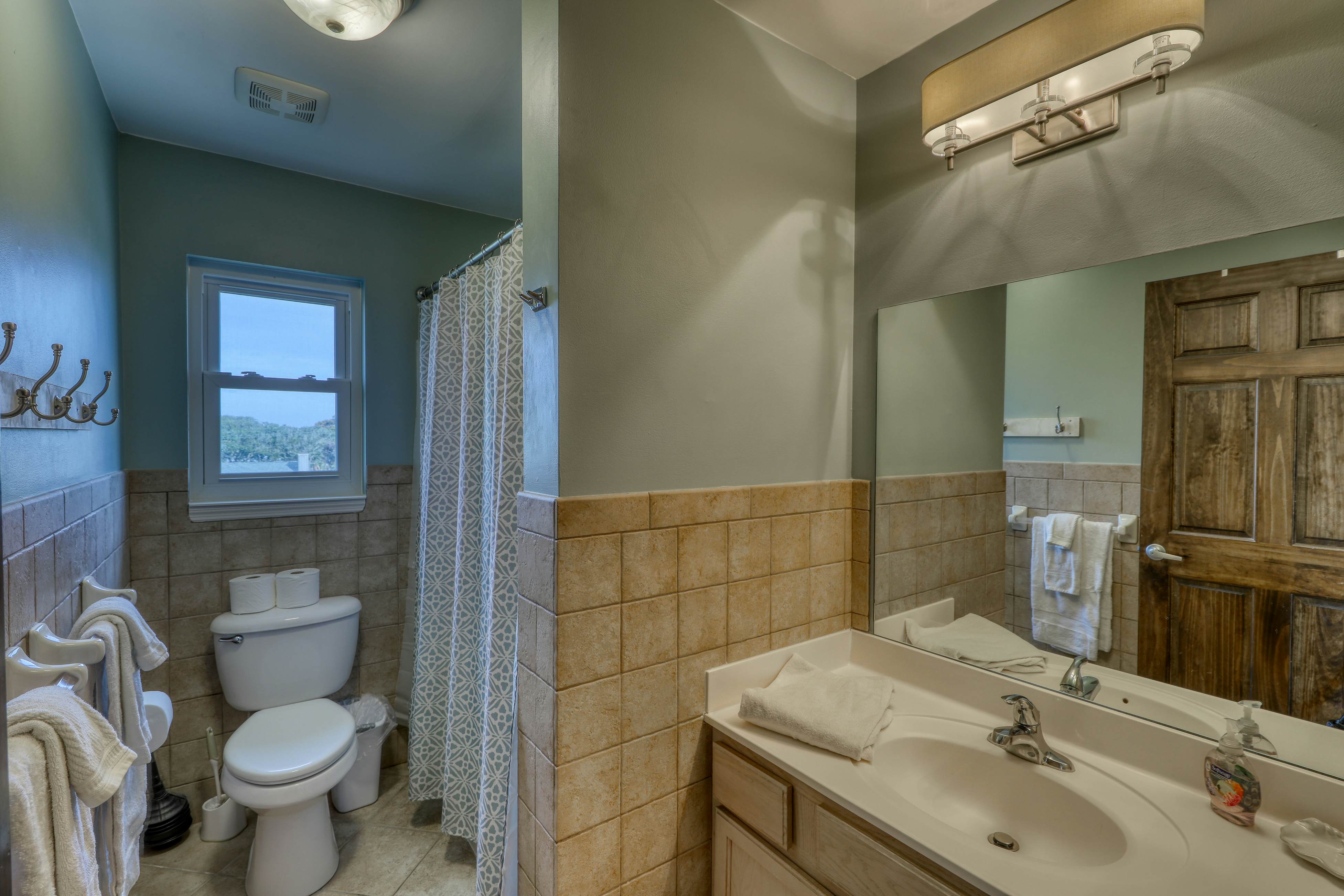 Raised oceanfront home with elevator & outdoor shower just steps from beach