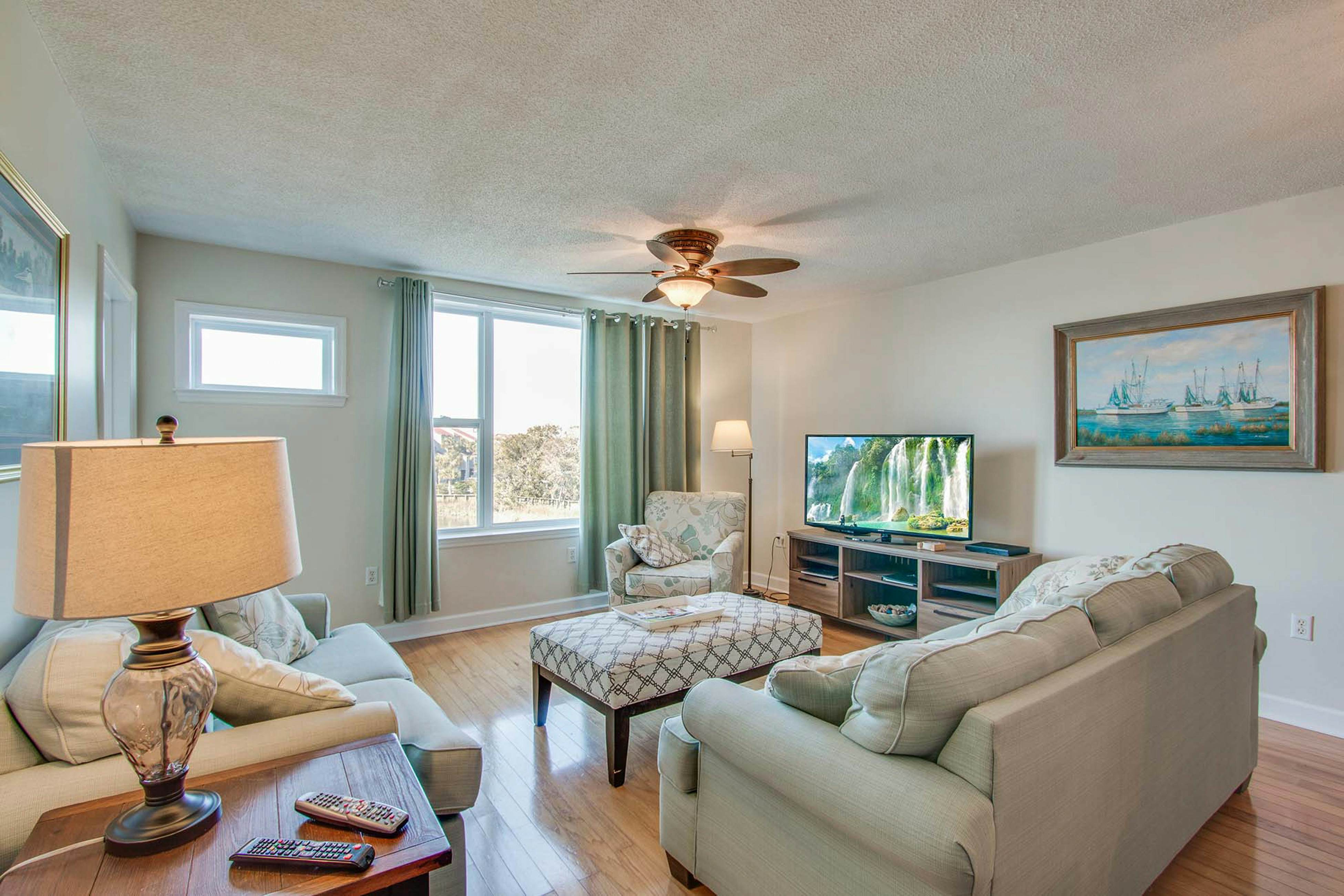 Second-floor condo with river views and access to a community pool