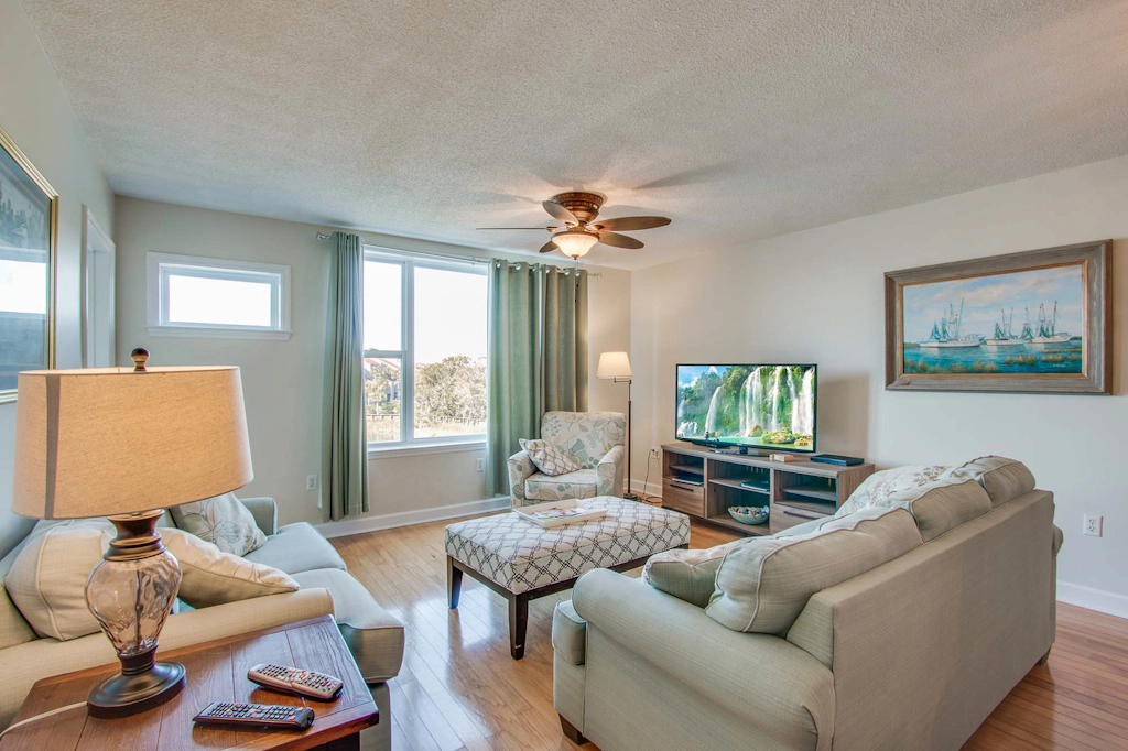 Second-floor condo with river views and access to a community pool