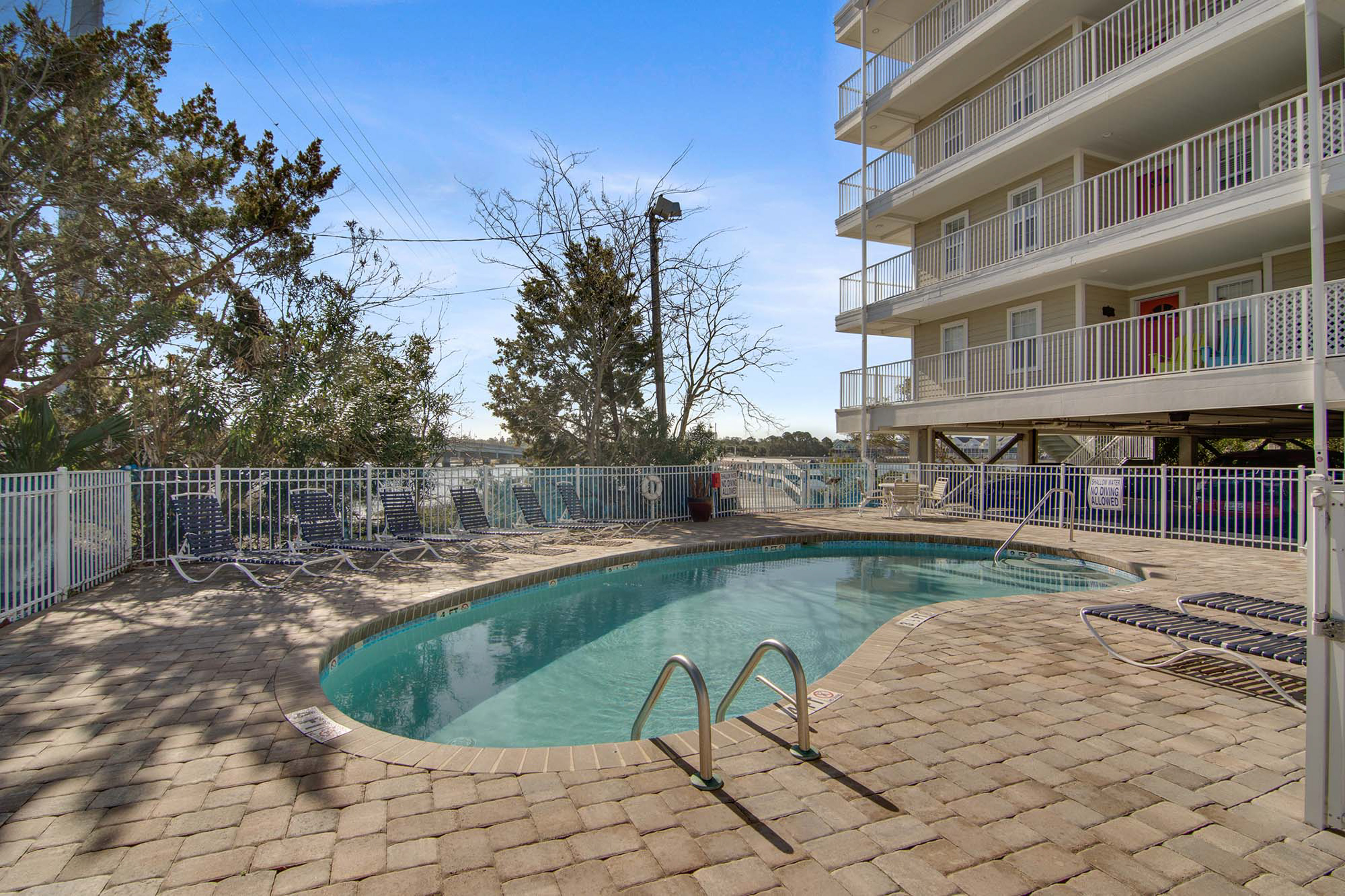 Second-floor condo with river views and access to a community pool