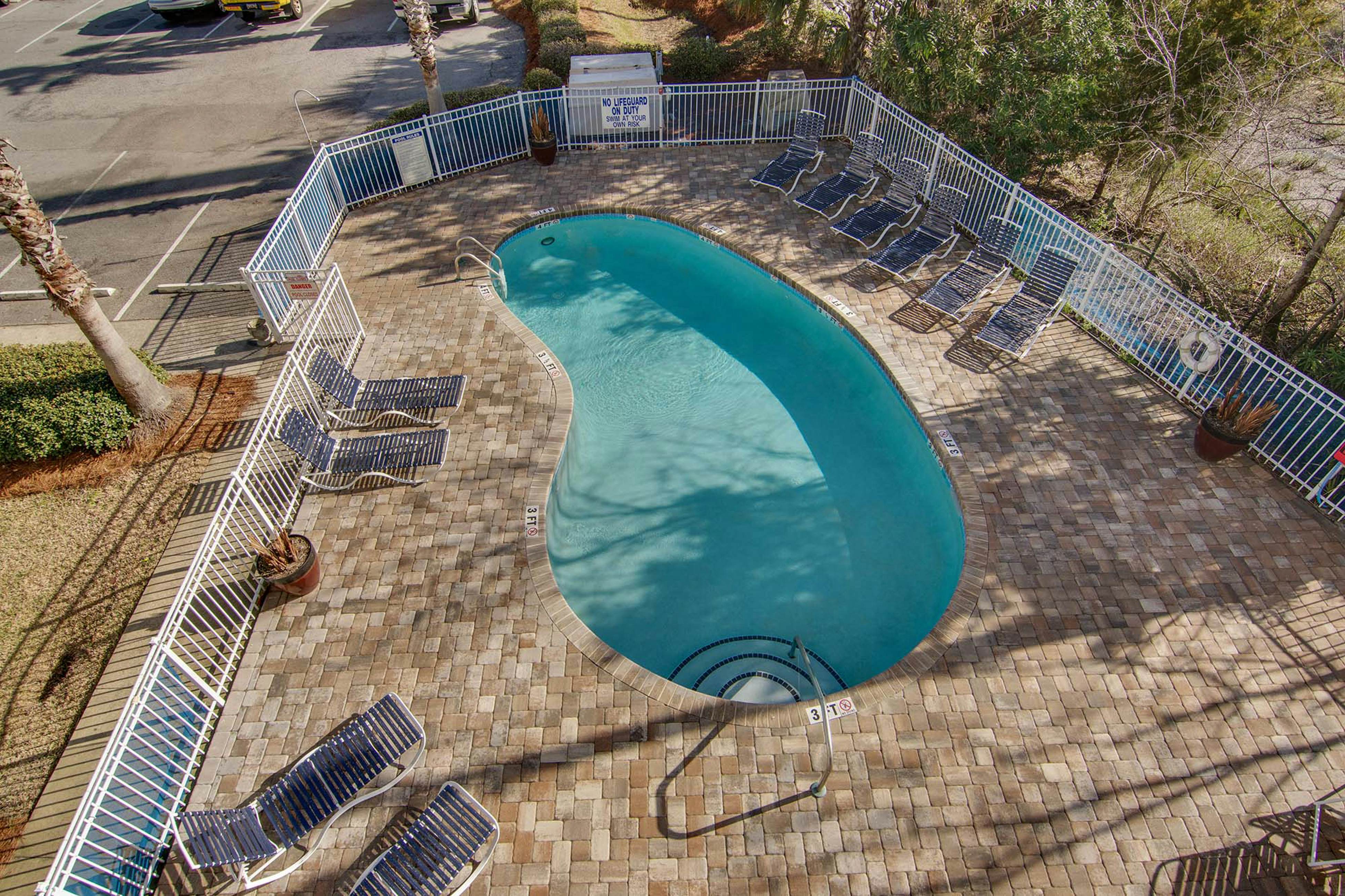 Second-floor condo with river views and access to a community pool