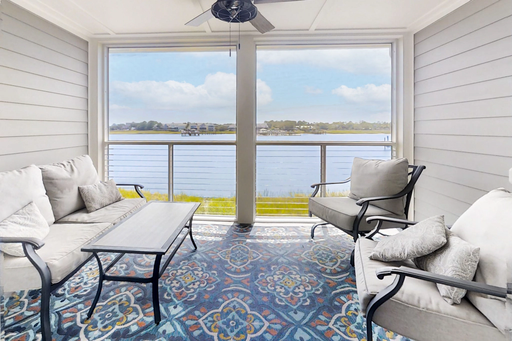 Newly renovated two-story waterfront condo with screened porch, pool, & tennis