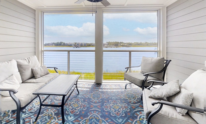 Newly renovated two-story waterfront condo with screened porch, pool, & tennis