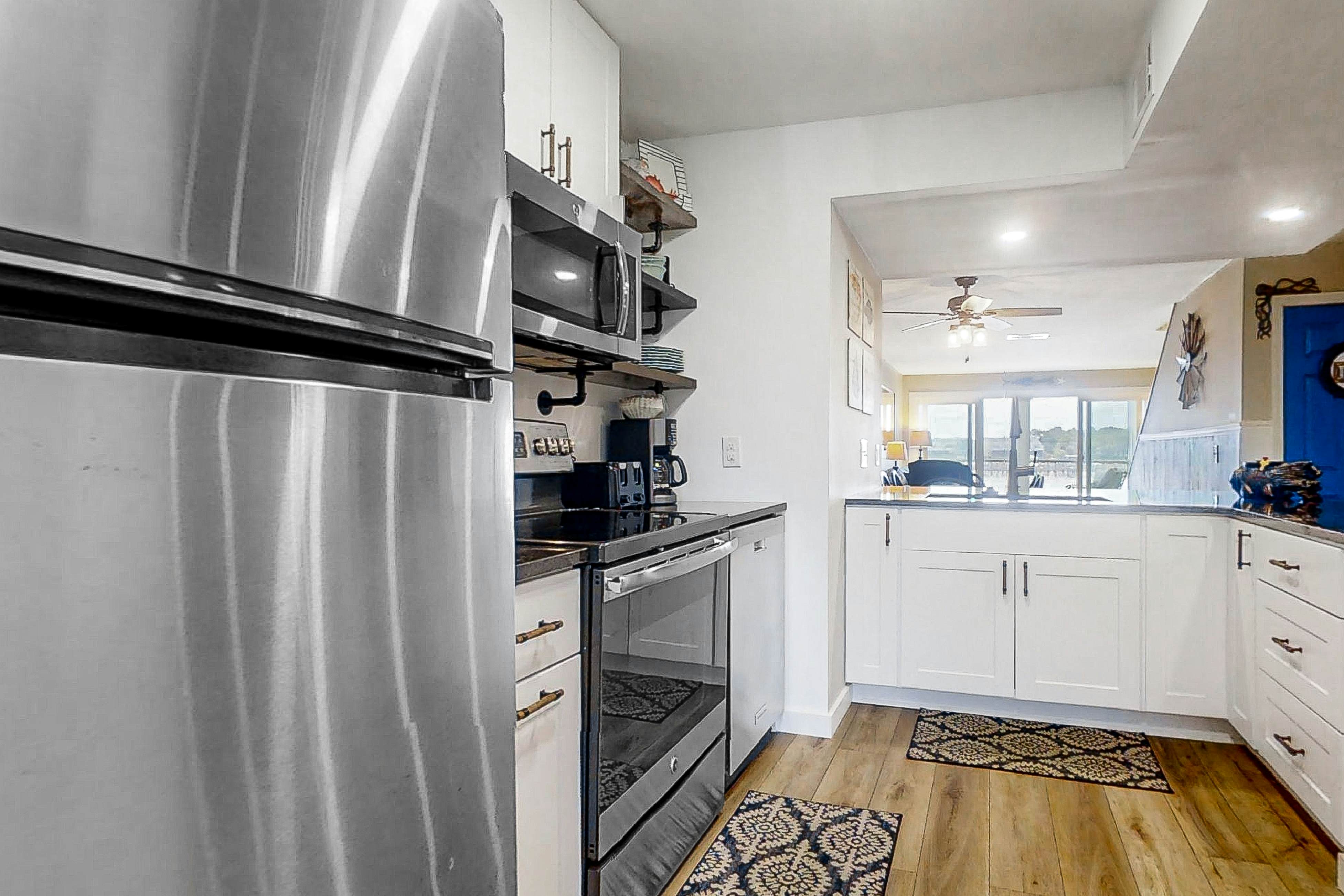 Newly renovated two-story waterfront condo with screened porch, pool, & tennis