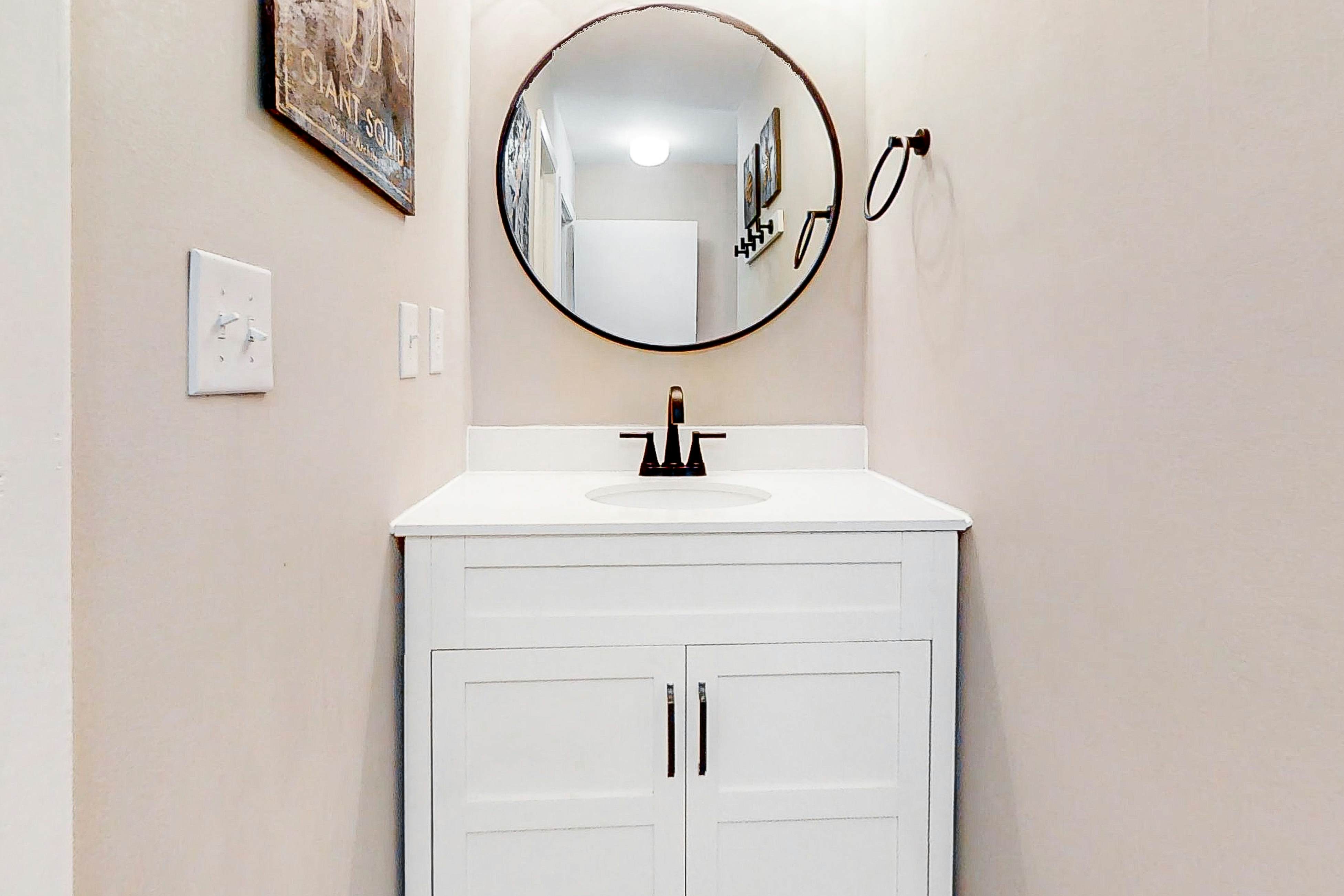 Newly renovated two-story waterfront condo with screened porch, pool, & tennis