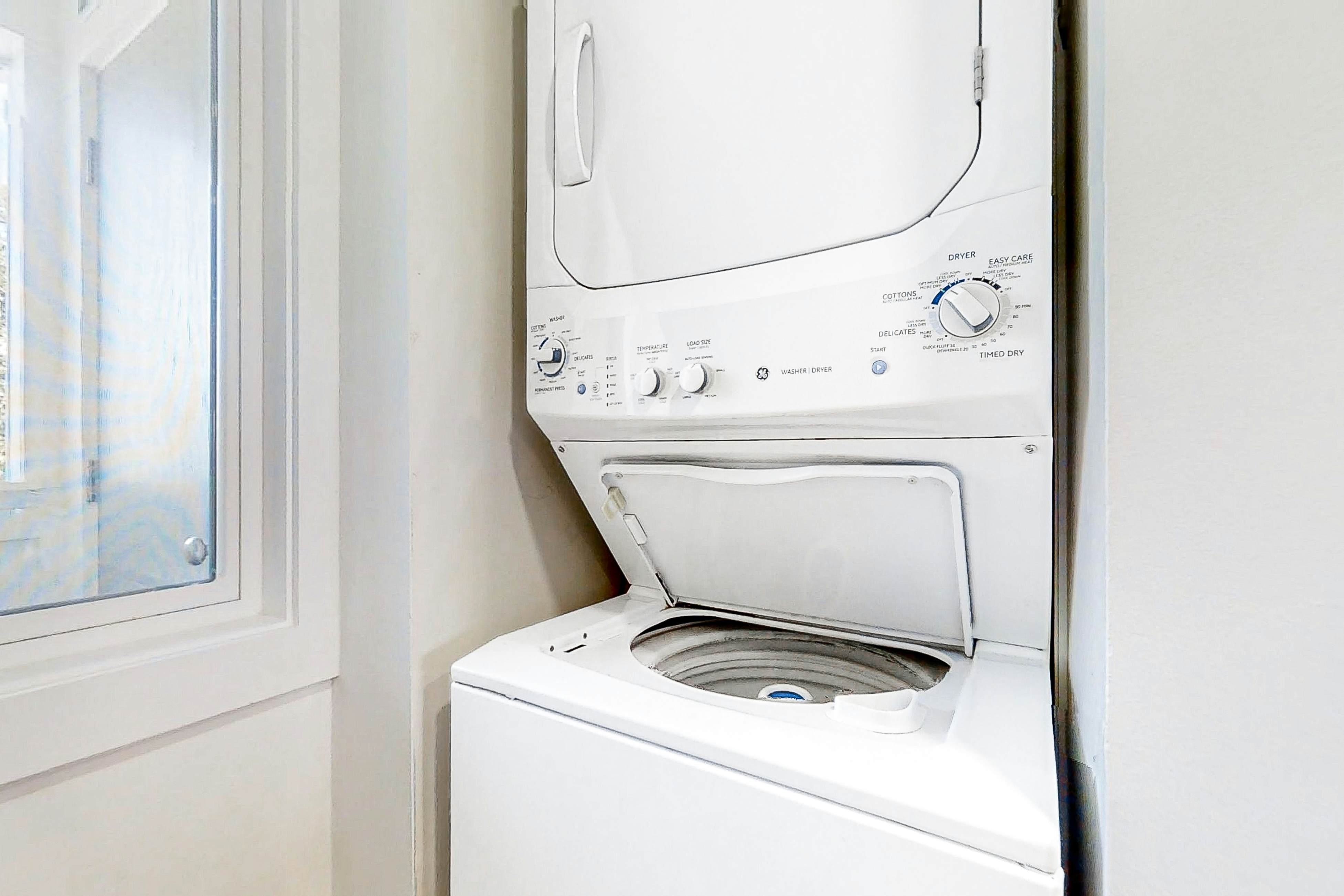 Newly renovated two-story waterfront condo with screened porch, pool, & tennis