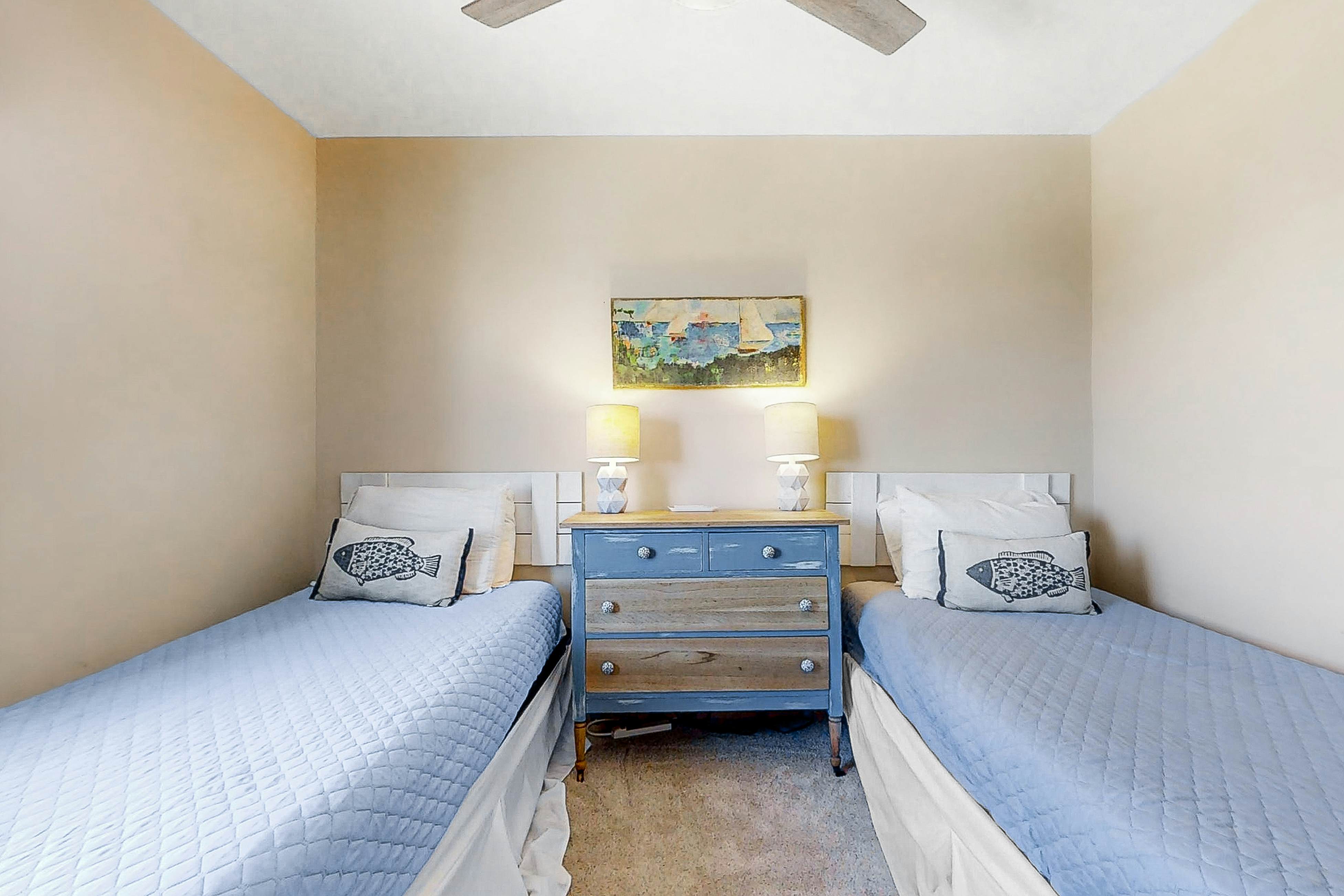 Newly renovated two-story waterfront condo with screened porch, pool, & tennis