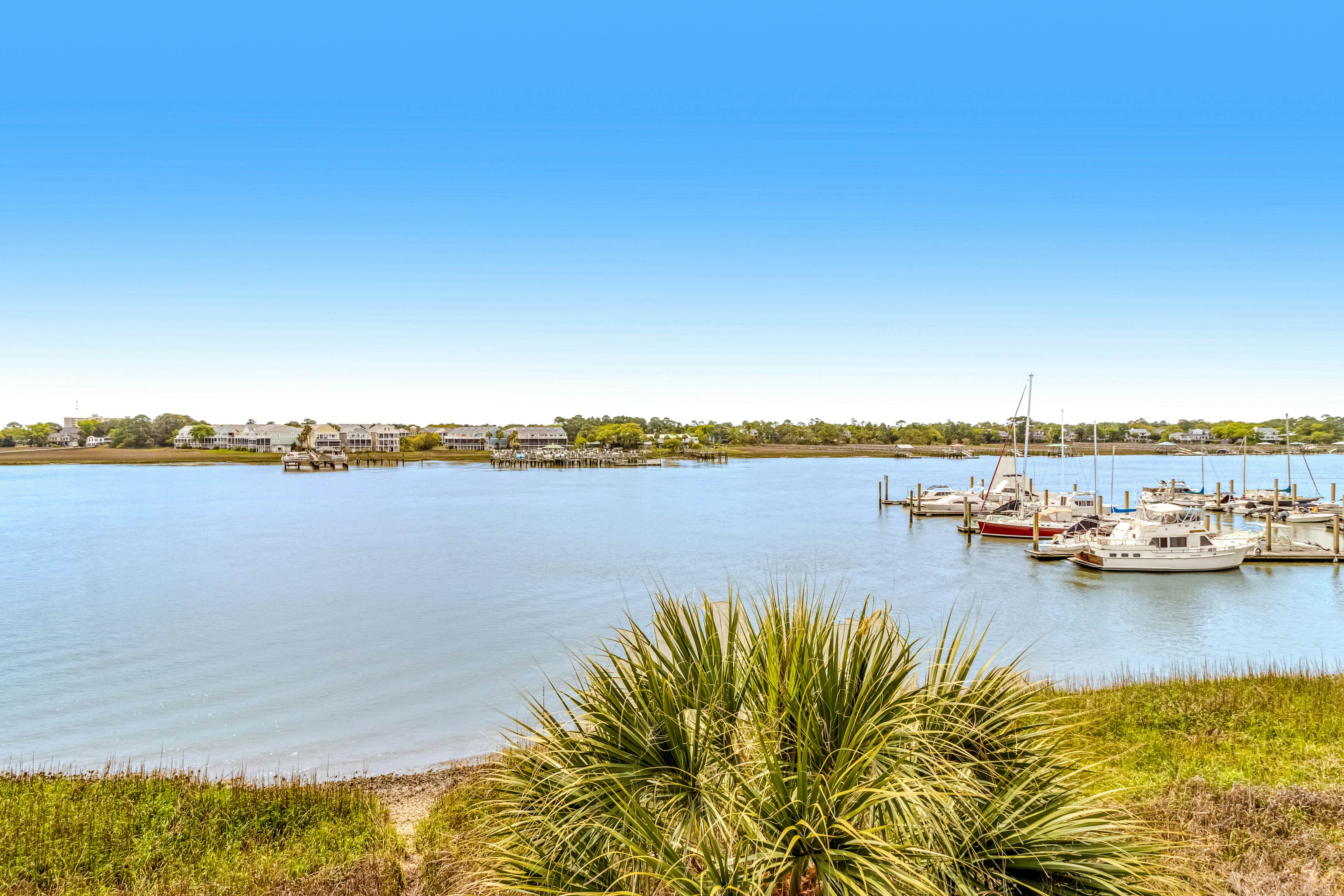 Newly renovated two-story waterfront condo with screened porch, pool, & tennis