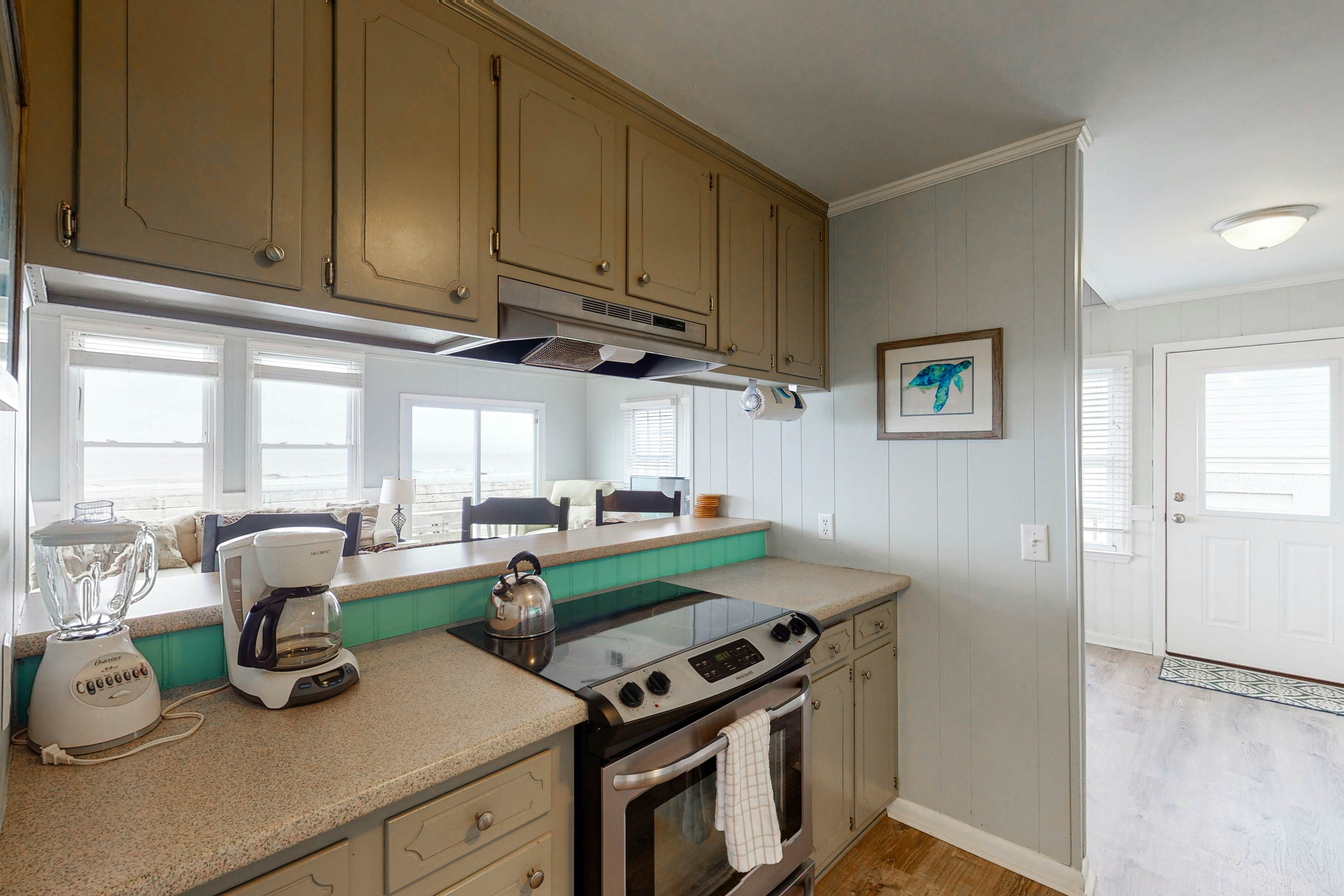 Oceanfront home with WiFi, full kitchen, & deck that spans the side of the home