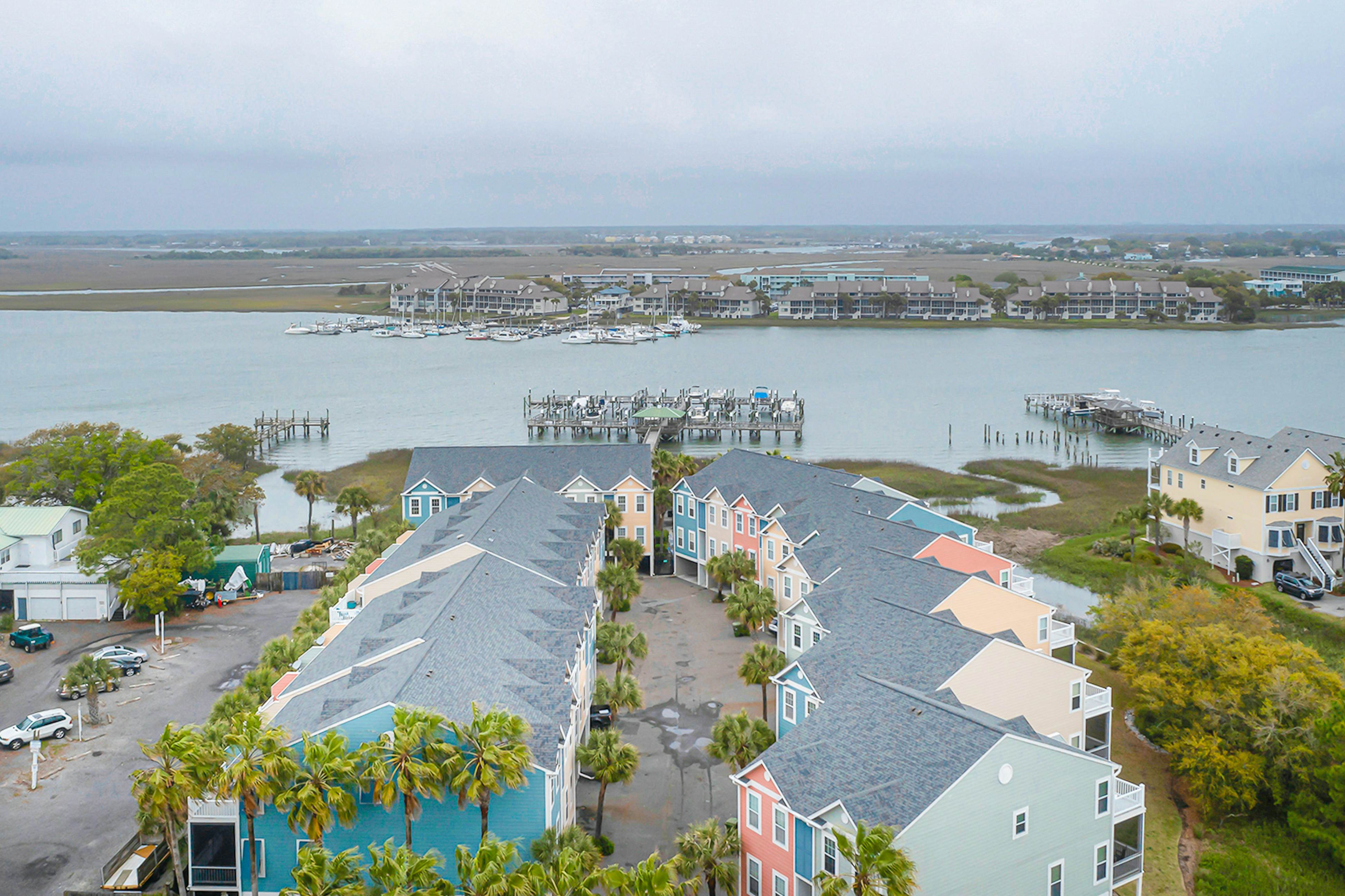 Beachy, three-story villa w/ deck & shared pool - walk downtown & to the beach