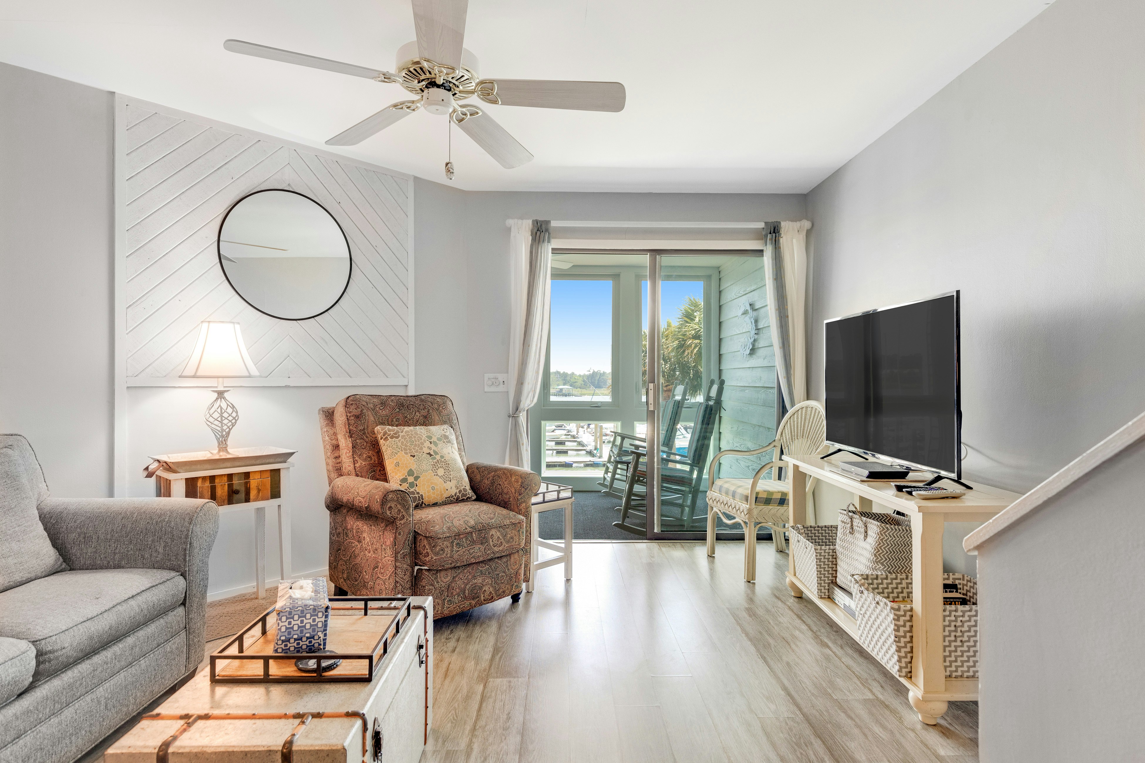 Second-floor villa w/ river views & community pool, tennis courts, and dock