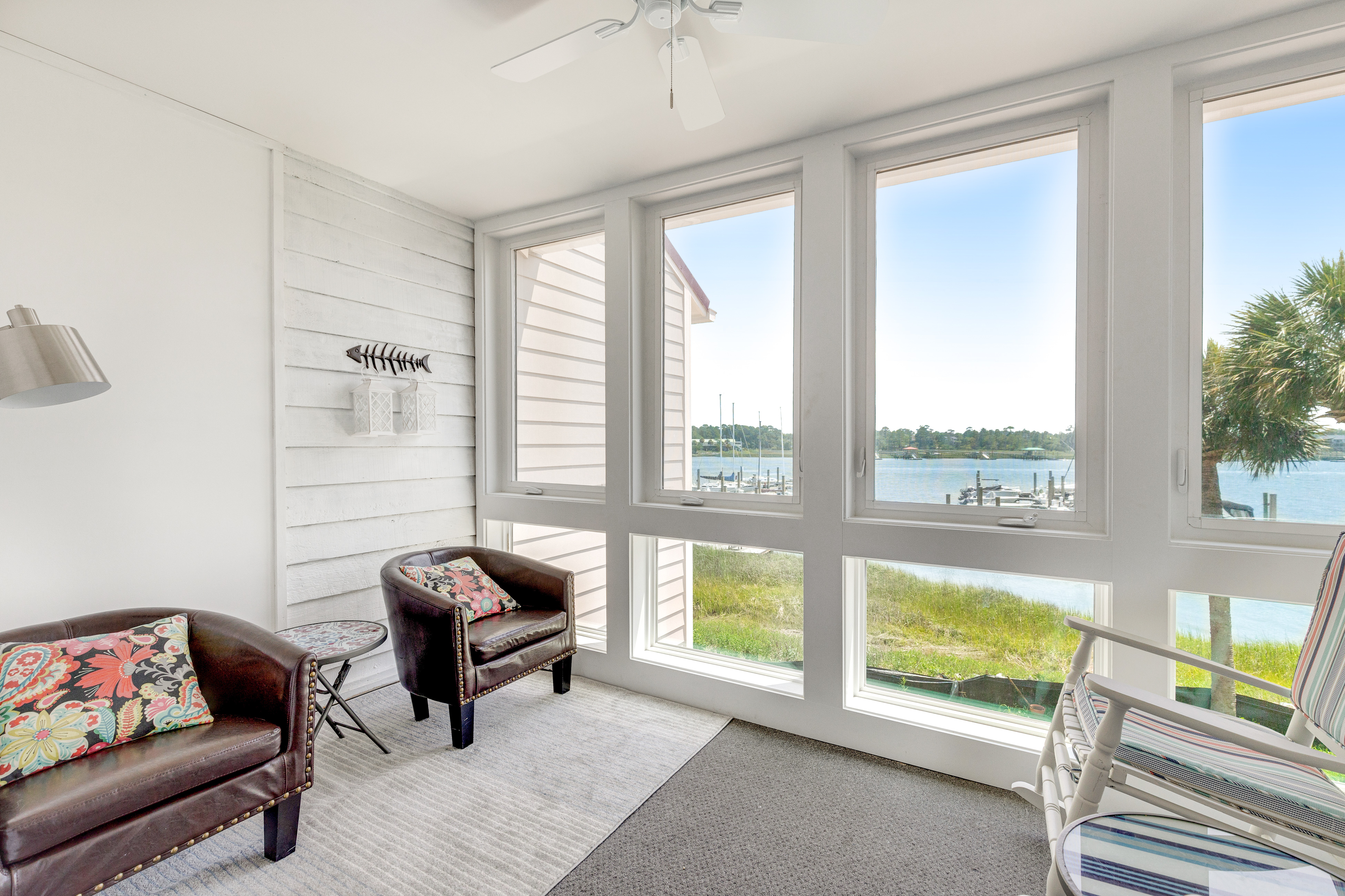 Second-floor villa w/ river views & community pool, tennis courts, and dock