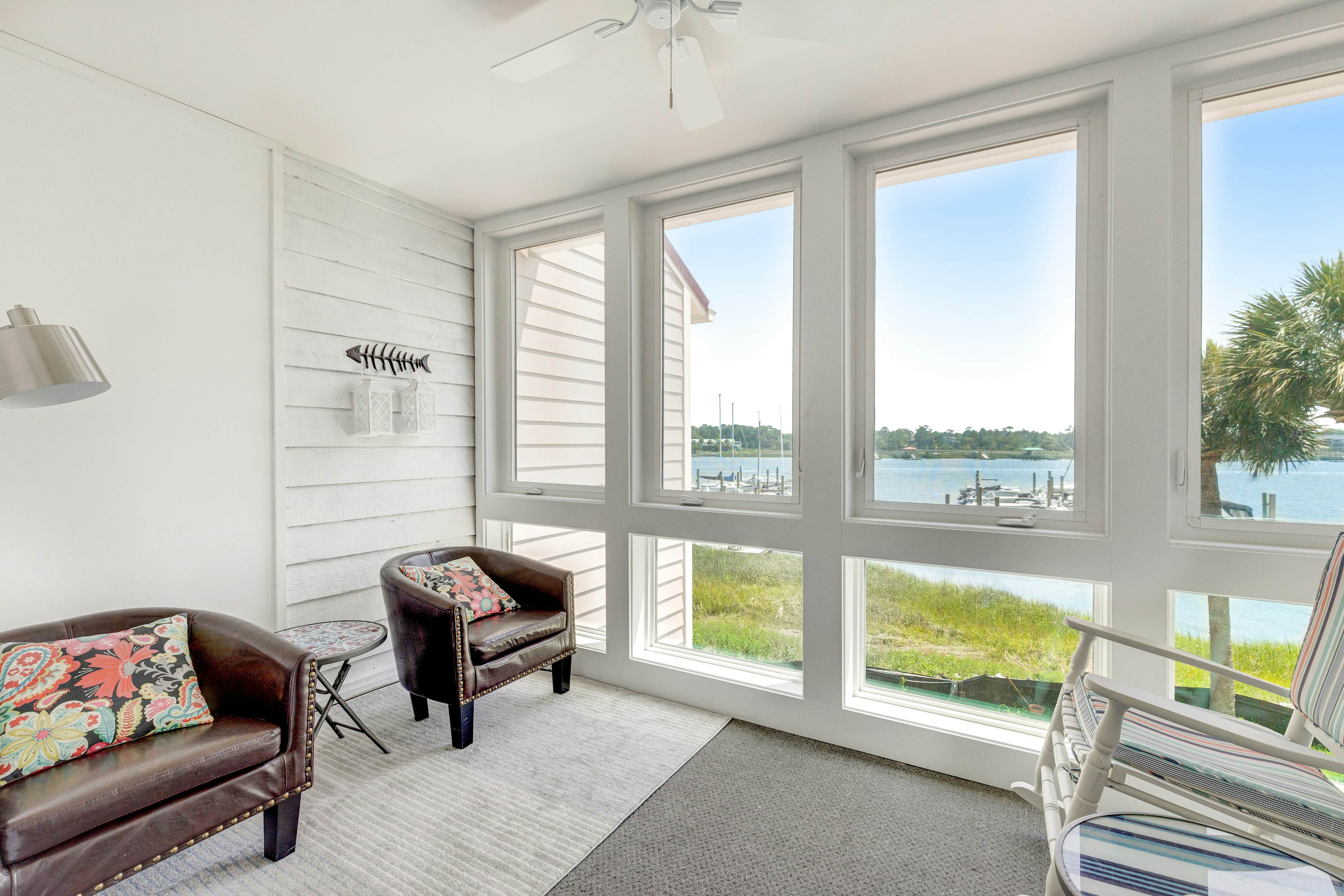 Second-floor villa w/ river views & community pool, tennis courts, and dock