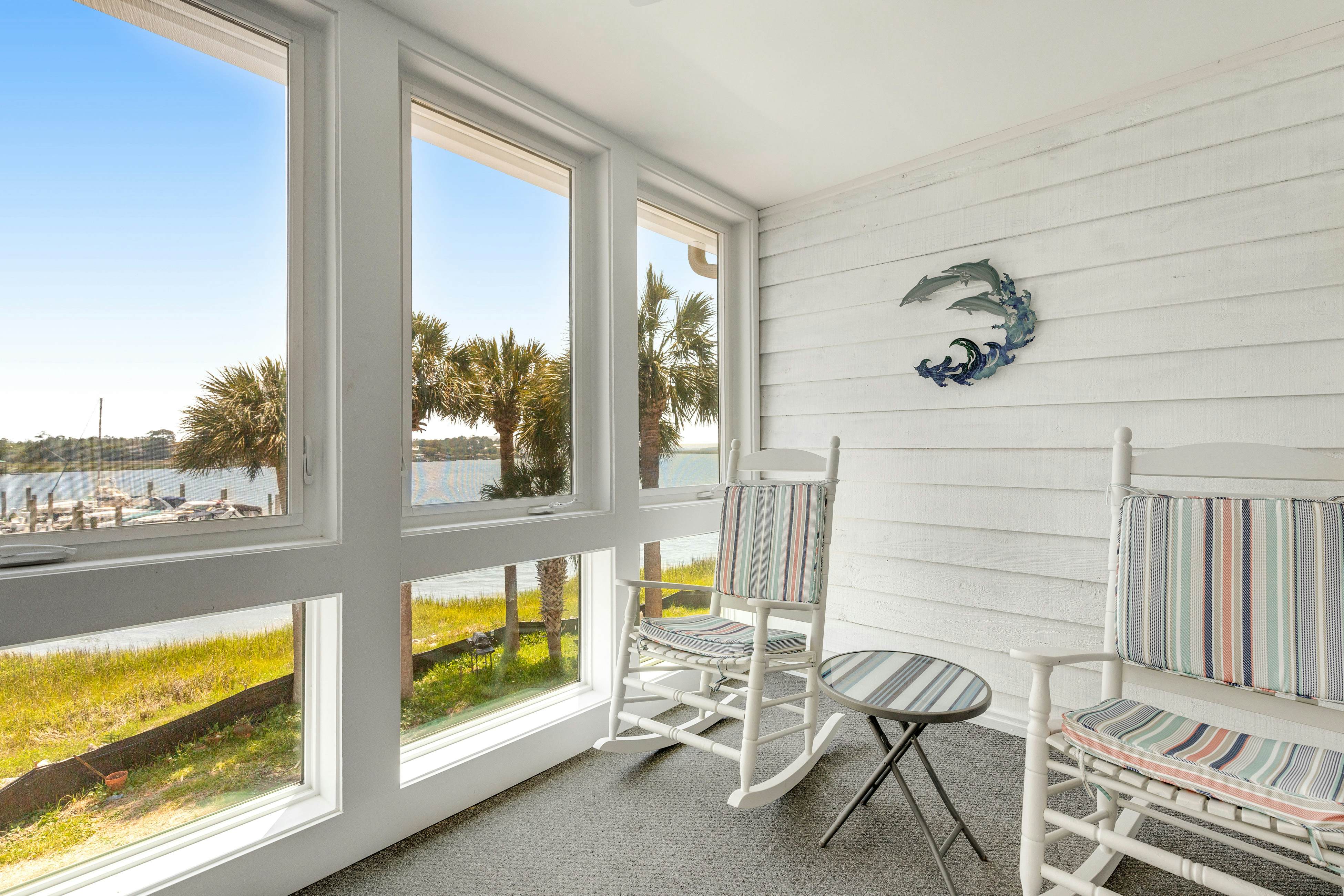 Second-floor villa w/ river views & community pool, tennis courts, and dock