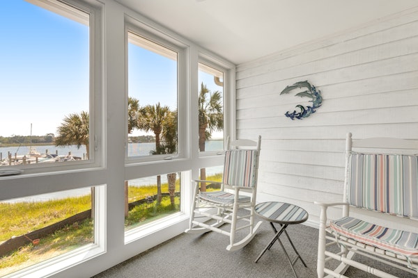 Second-floor villa w/ river views & community pool, tennis courts, and dock