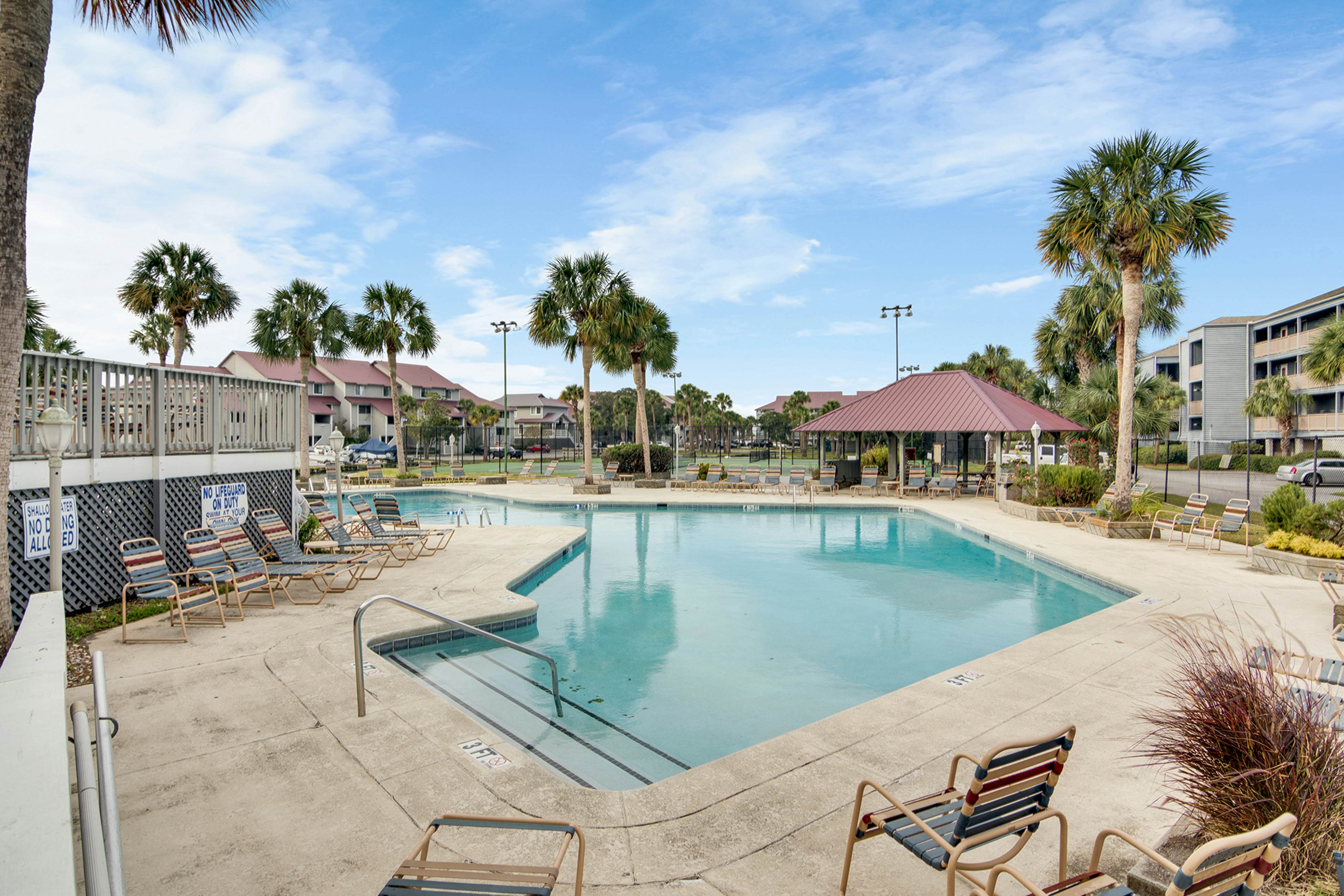 Second-floor villa w/ river views & community pool, tennis courts, and dock