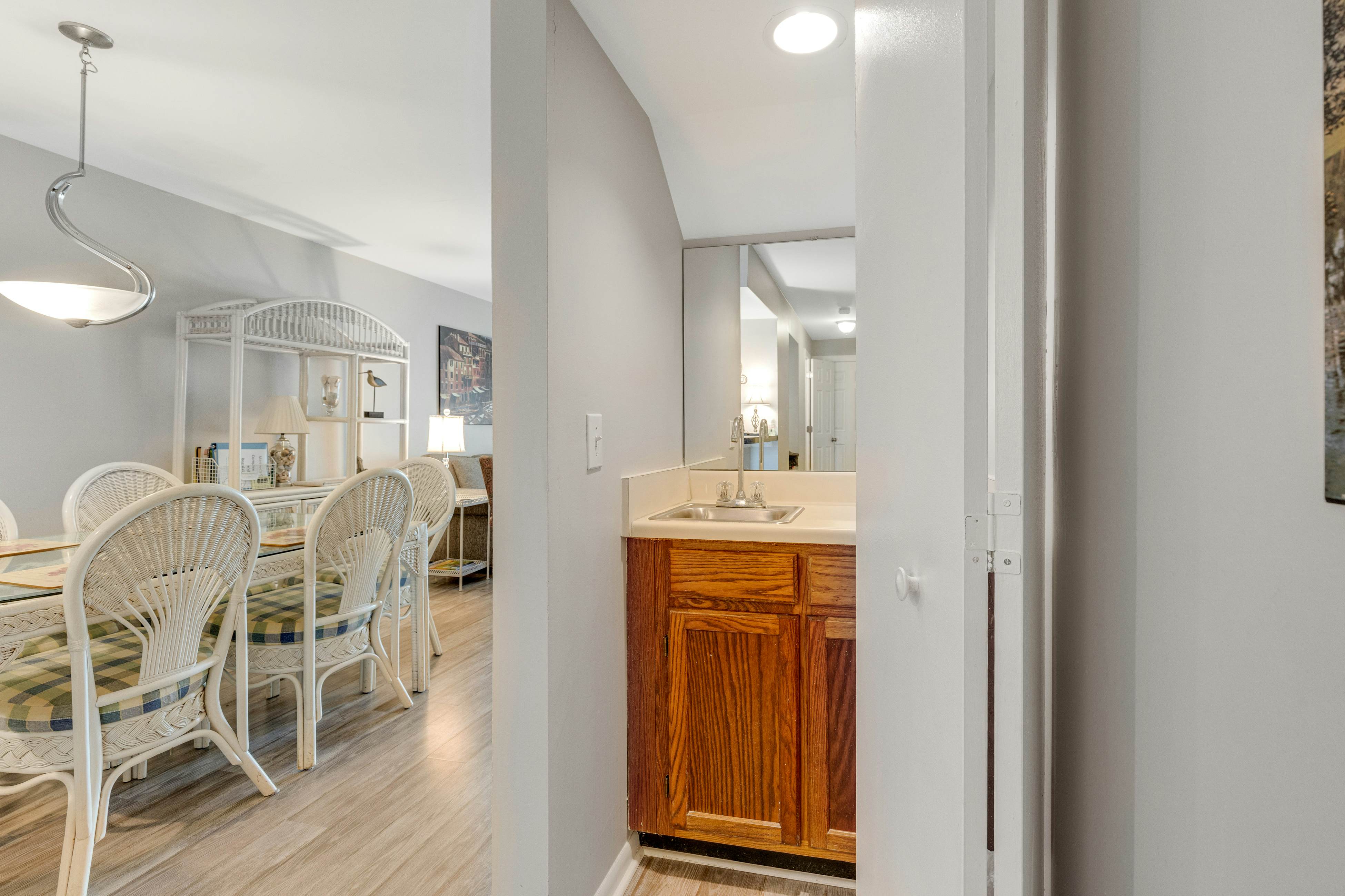 Second-floor villa w/ river views & community pool, tennis courts, and dock