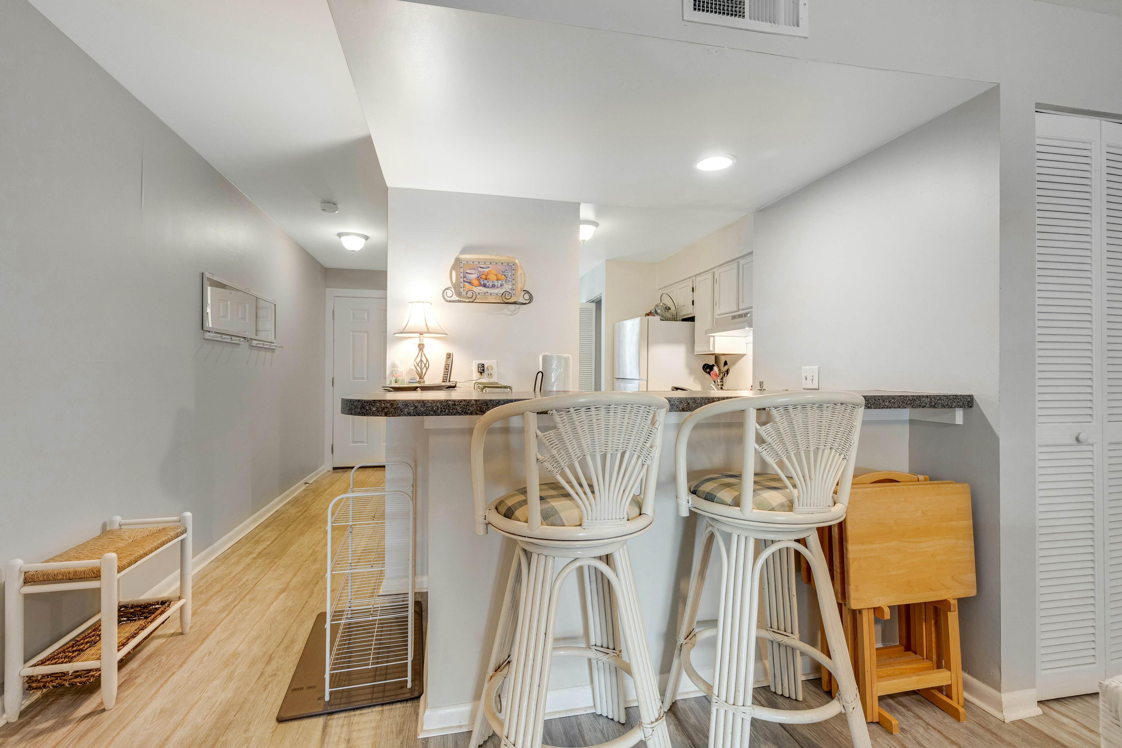 Second-floor villa w/ river views & community pool, tennis courts, and dock