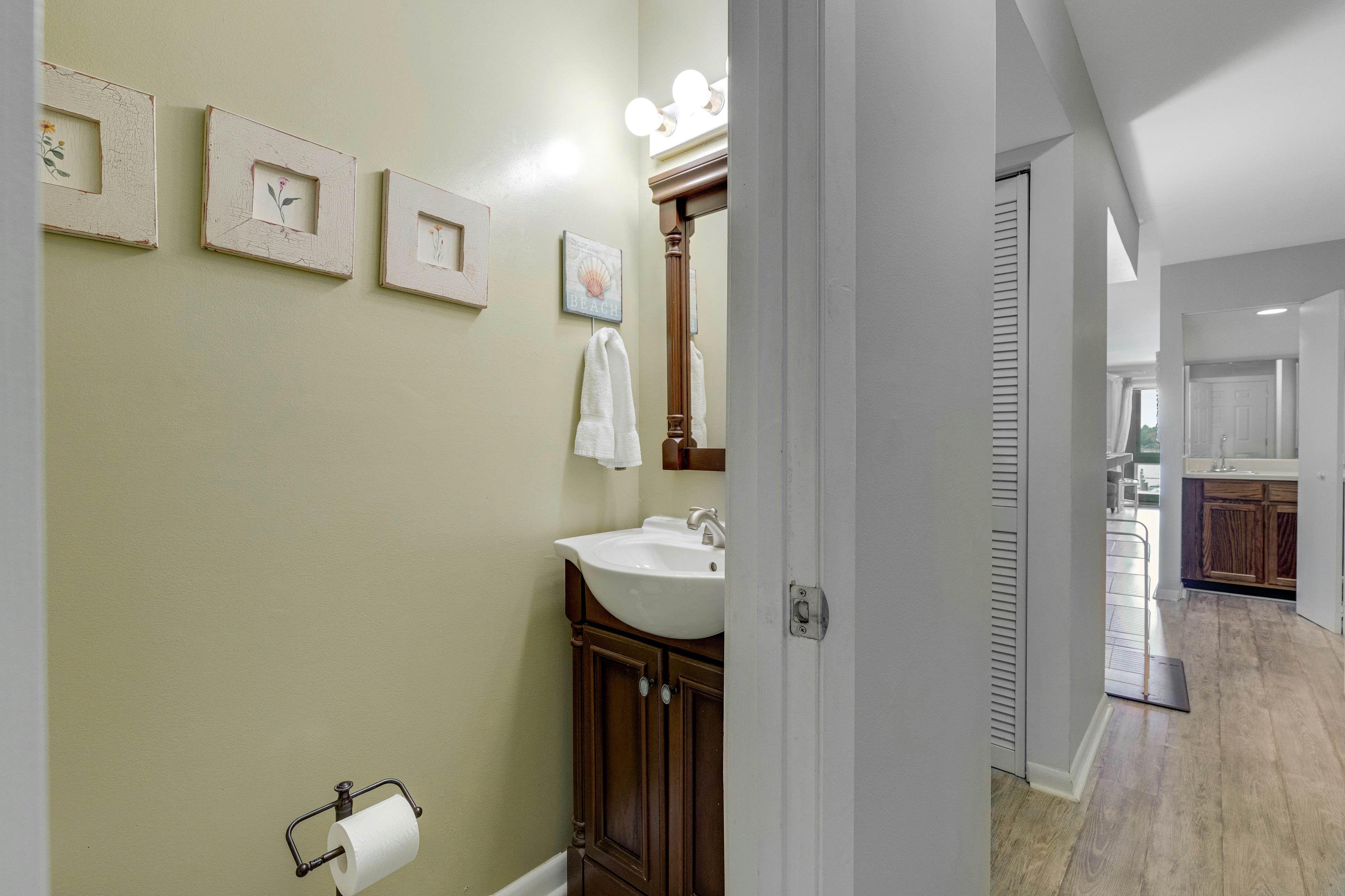 Second-floor villa w/ river views & community pool, tennis courts, and dock