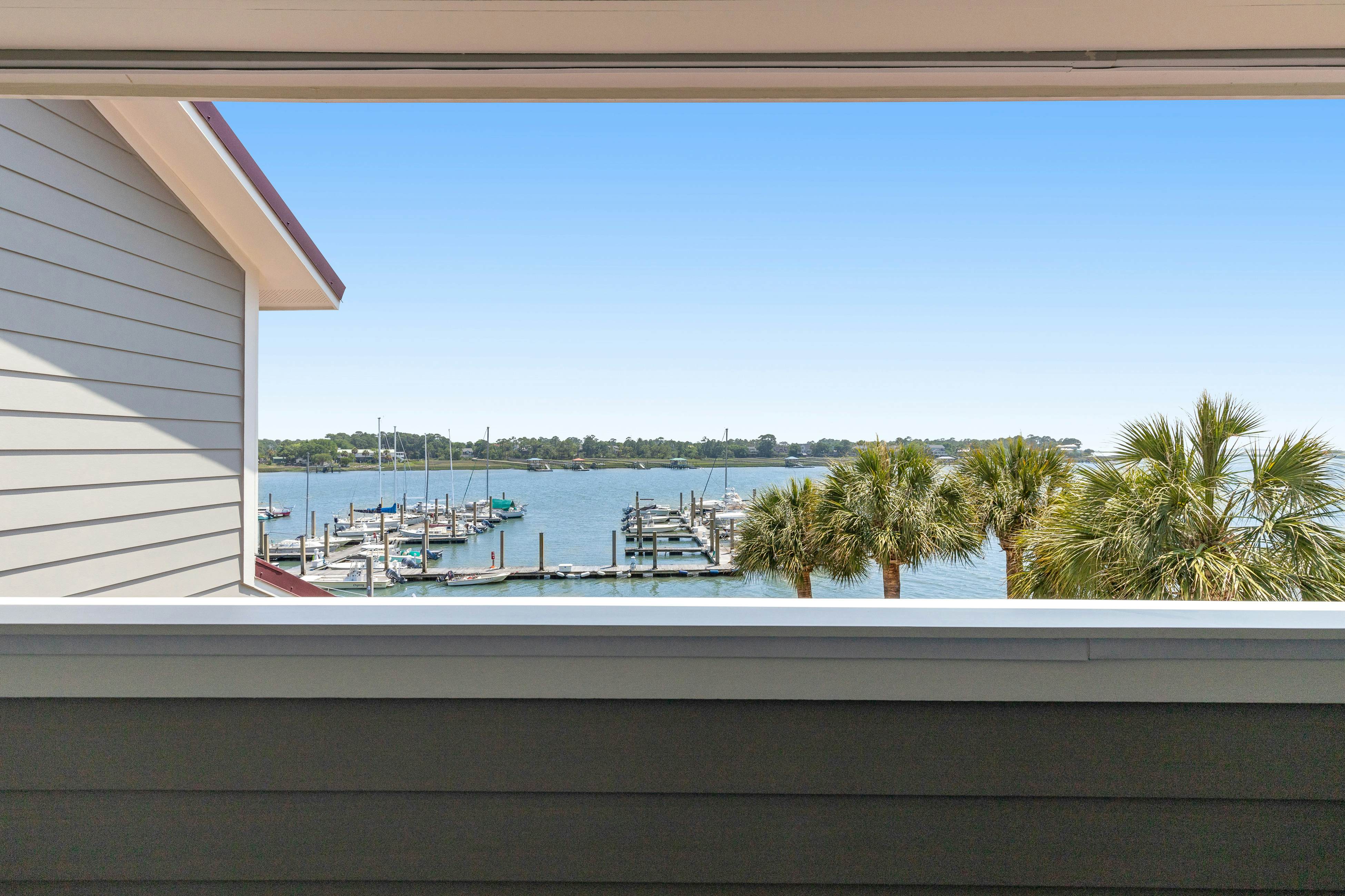 Second-floor villa w/ river views & community pool, tennis courts, and dock