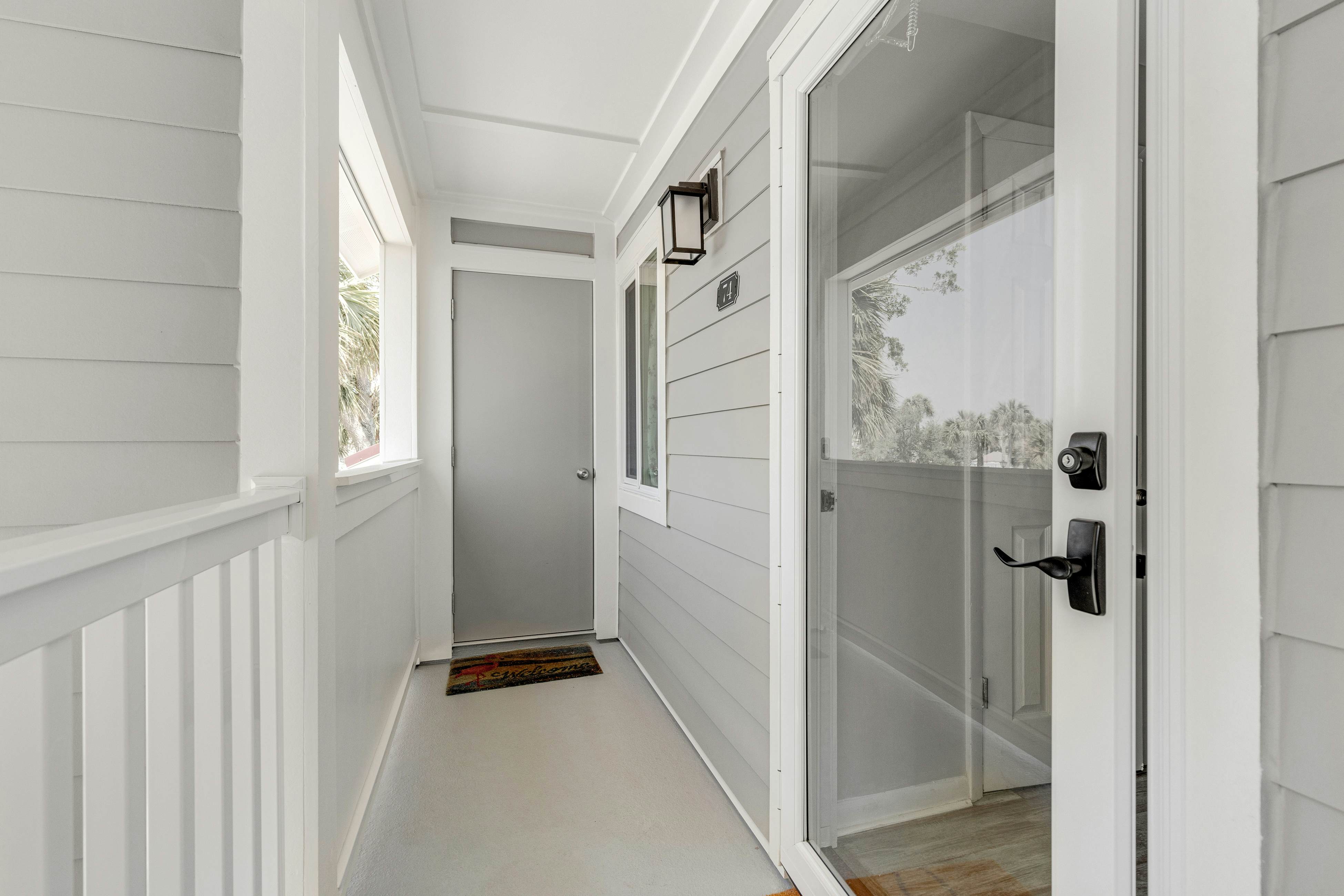 Second-floor villa w/ river views & community pool, tennis courts, and dock