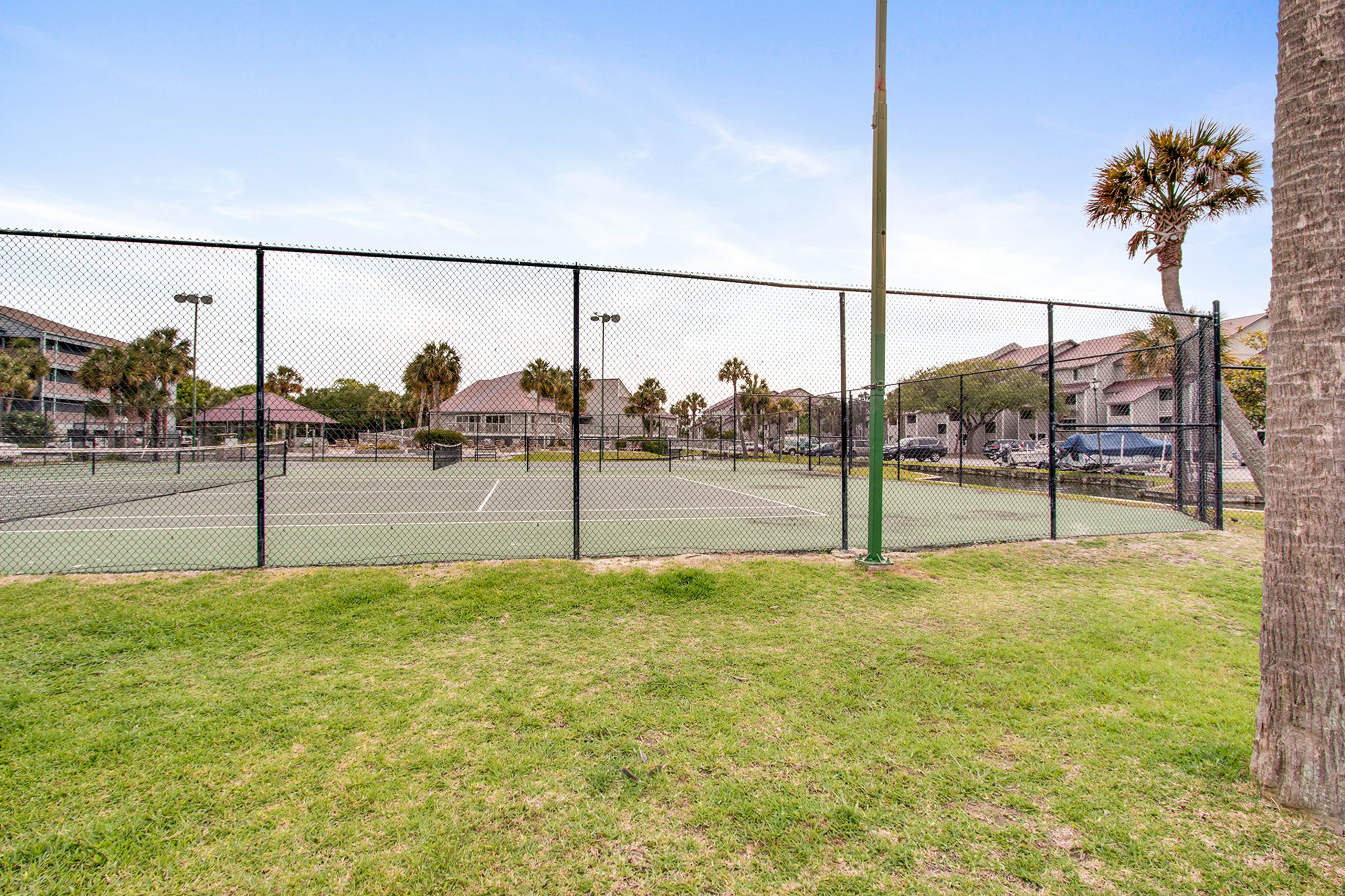 Second-floor villa w/ river views & community pool, tennis courts, and dock