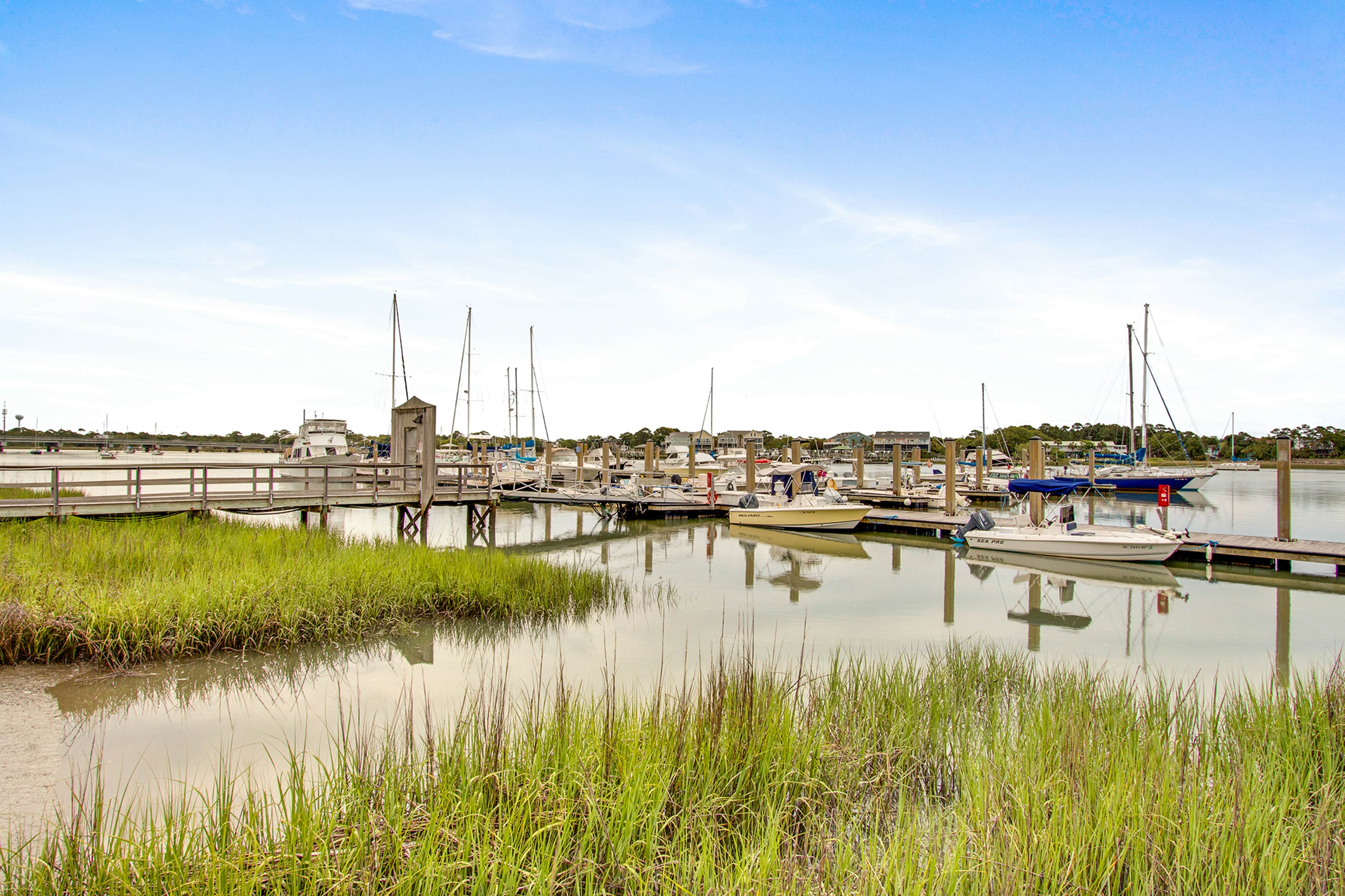 Second-floor villa w/ river views & community pool, tennis courts, and dock