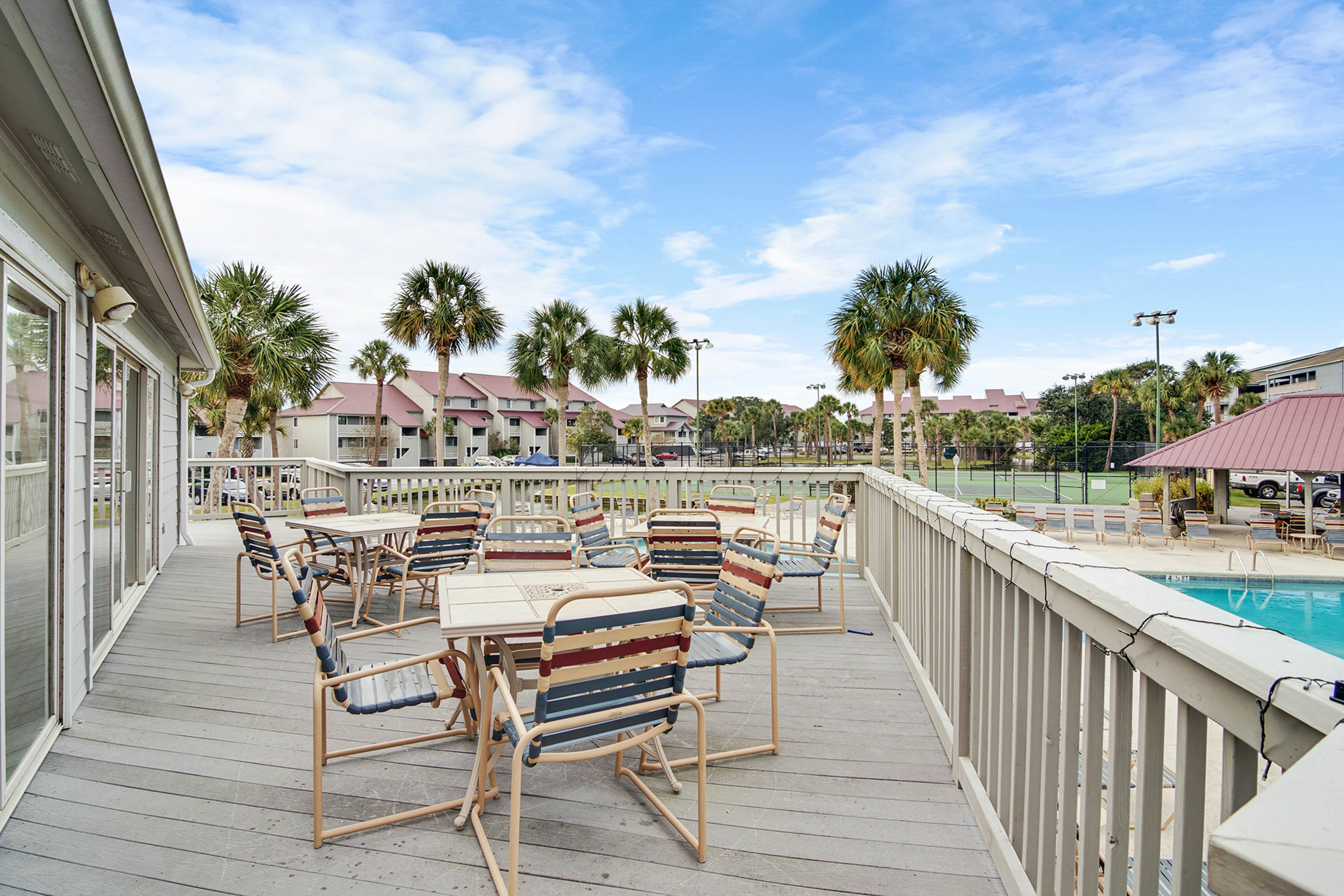 Second-floor villa w/ river views & community pool, tennis courts, and dock