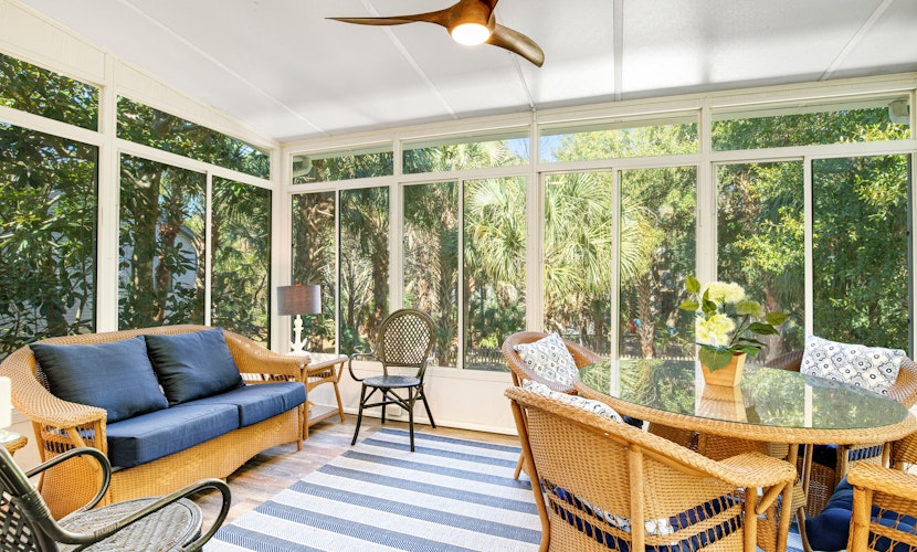 Palmetto-lined home with porches, yard & hammock - walk to beach/town