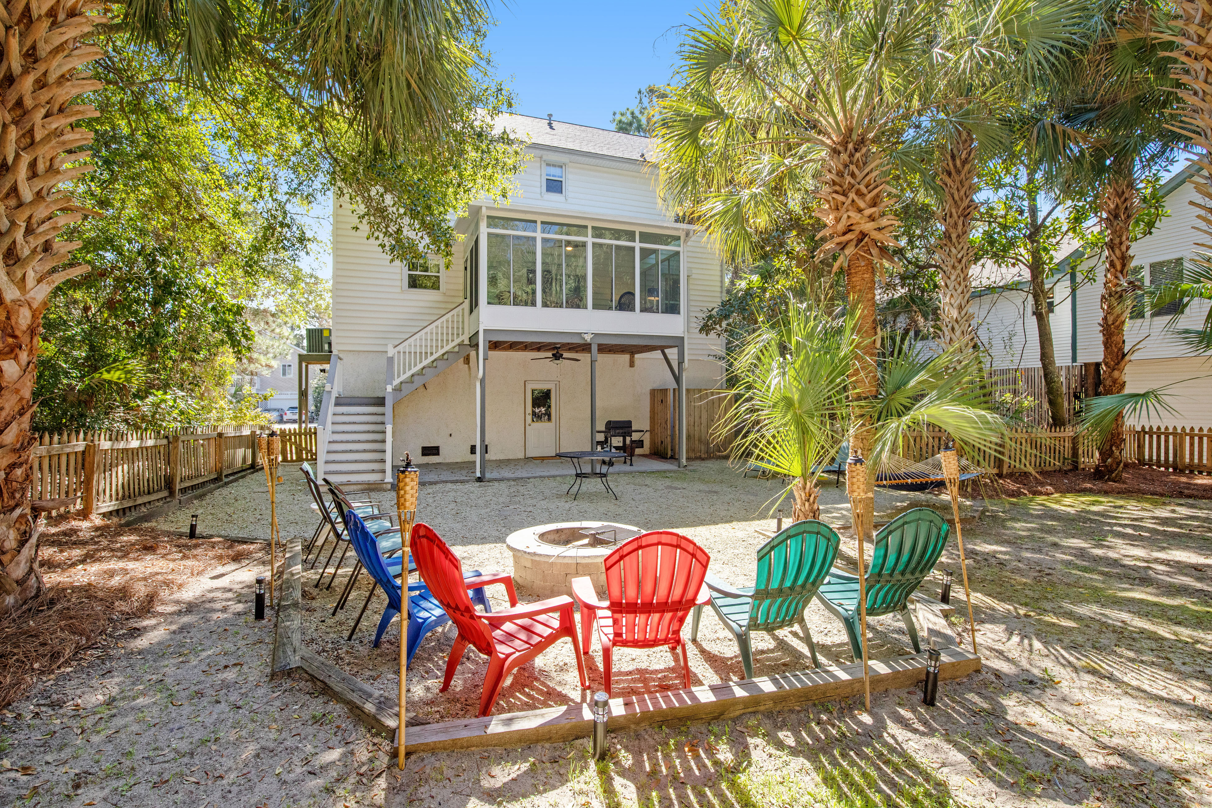 Palmetto-lined home with porches, yard & hammock - walk to beach/town