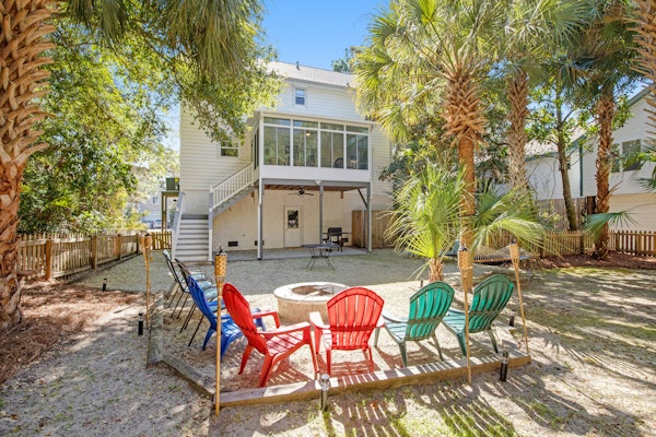 Palmetto-lined home with porches, yard & hammock - walk to beach/town