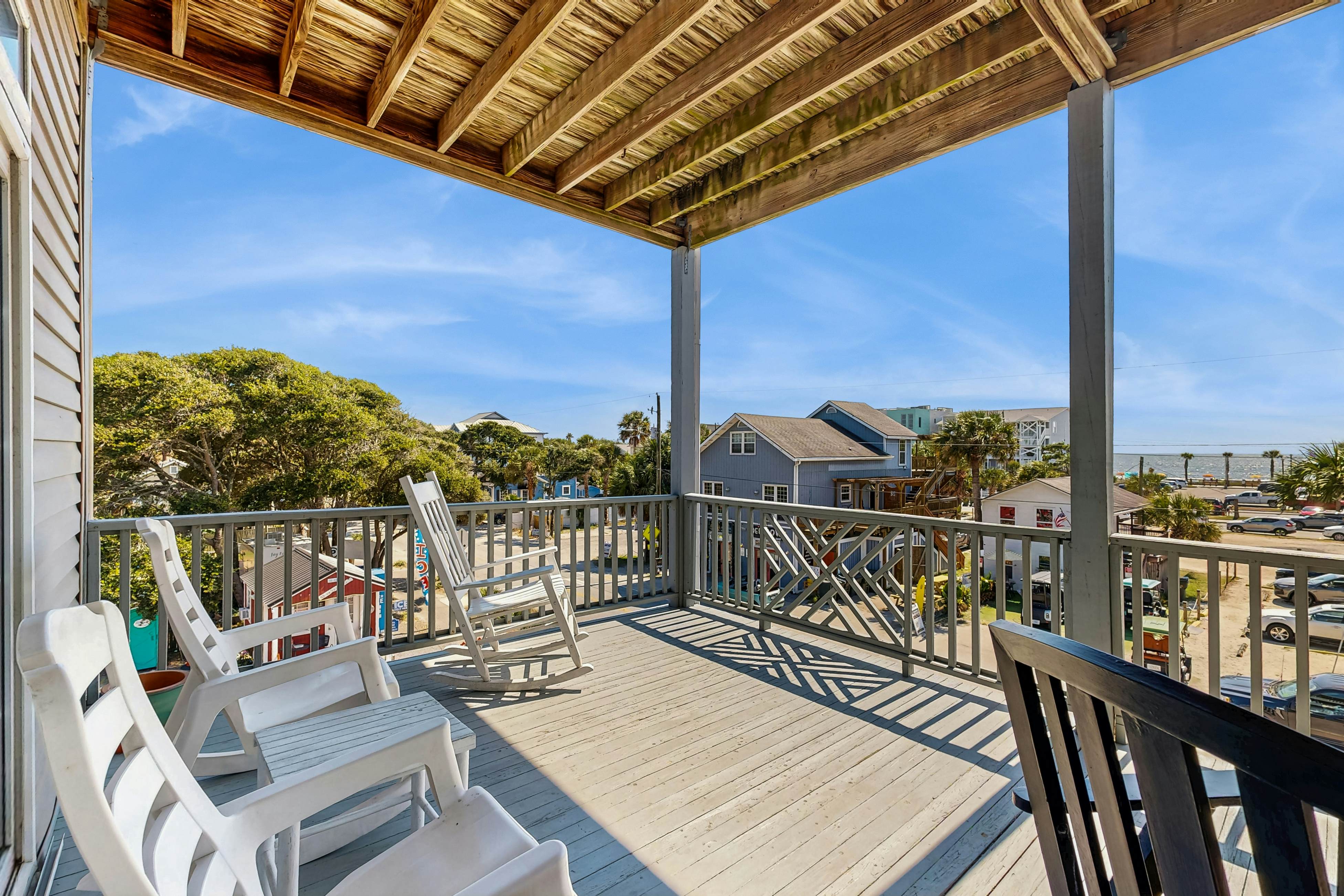 First-floor villa w/partial ocean views, covered porch -one block from the beach