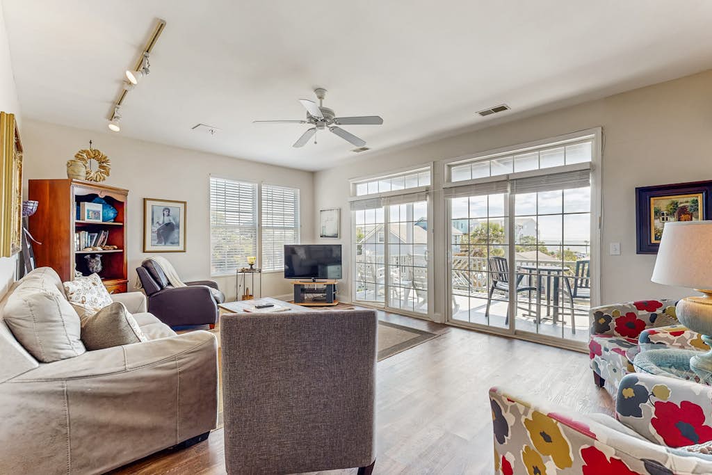 First-floor villa w/partial ocean views, covered porch -one block from the beach