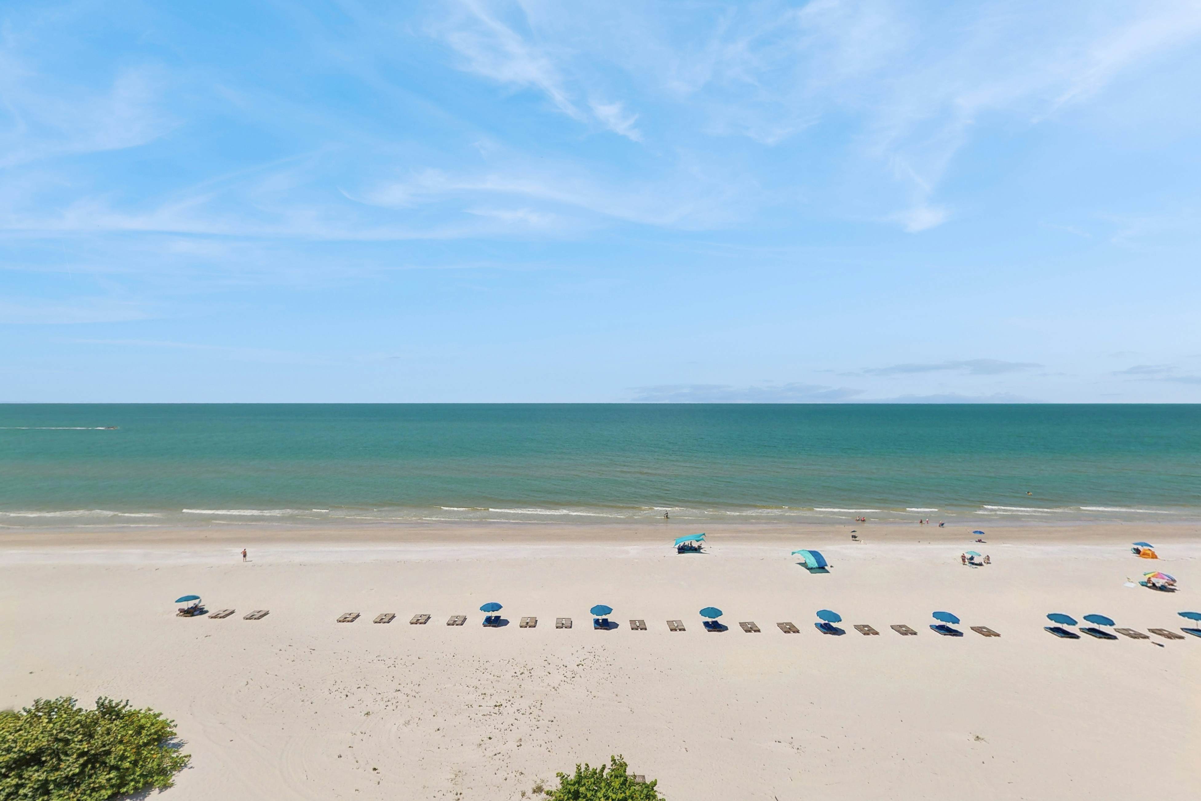 Direct beachfront beauty with sweeping coastal views