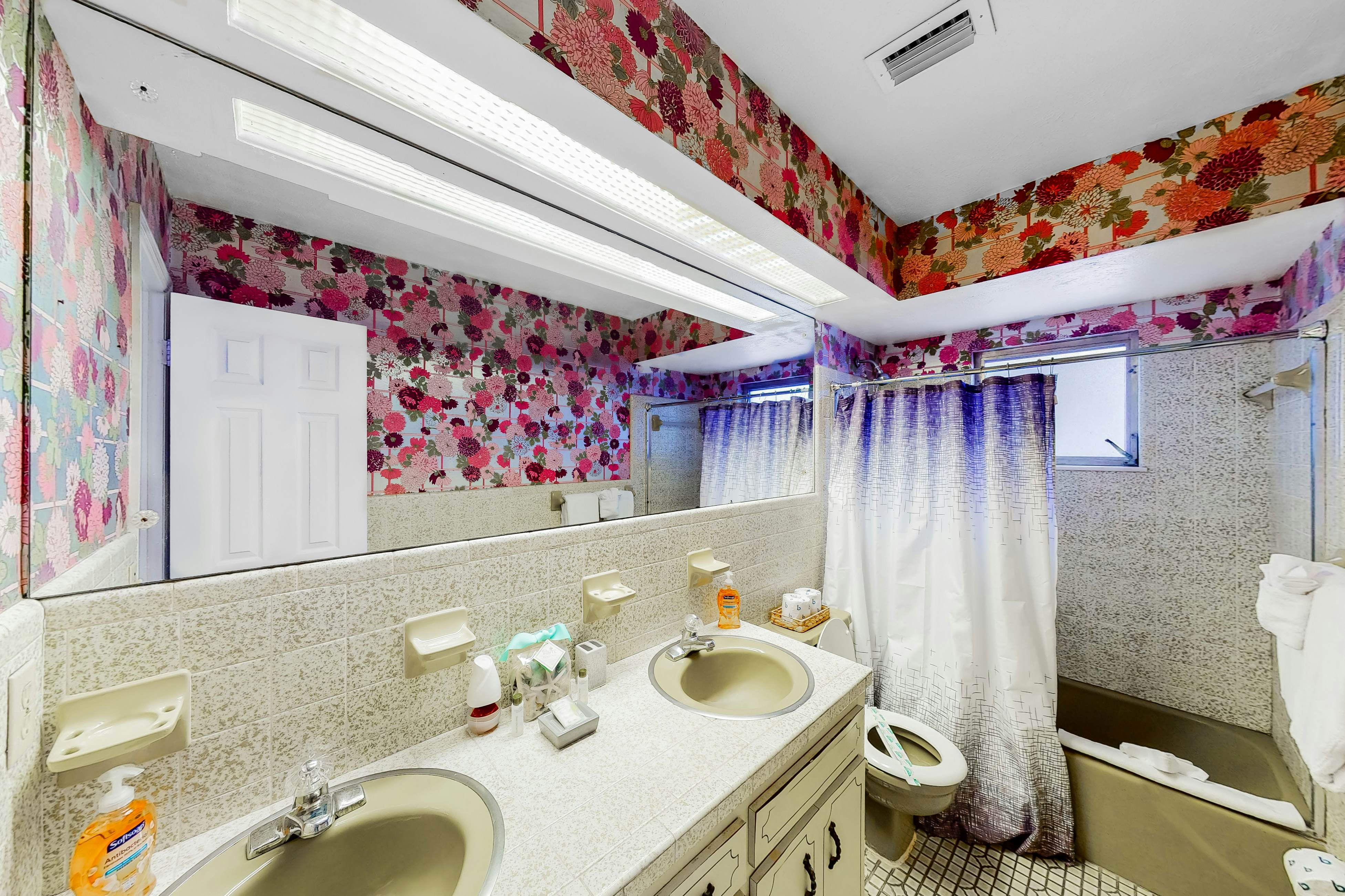 Dog-friendly house with water view, dock, & beach access - snowbirds welcome