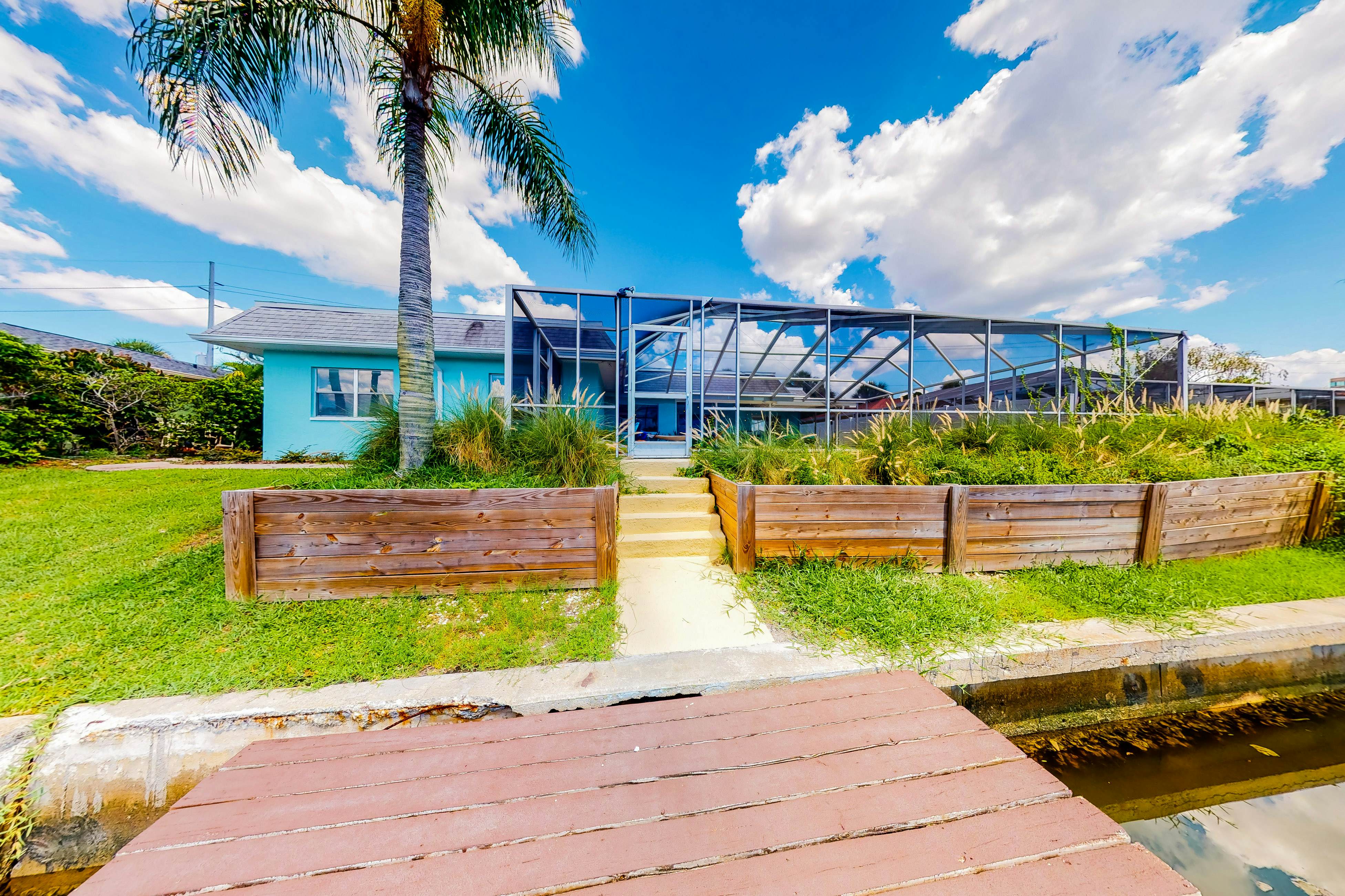 Dog-friendly house with water view, dock, & beach access - snowbirds welcome