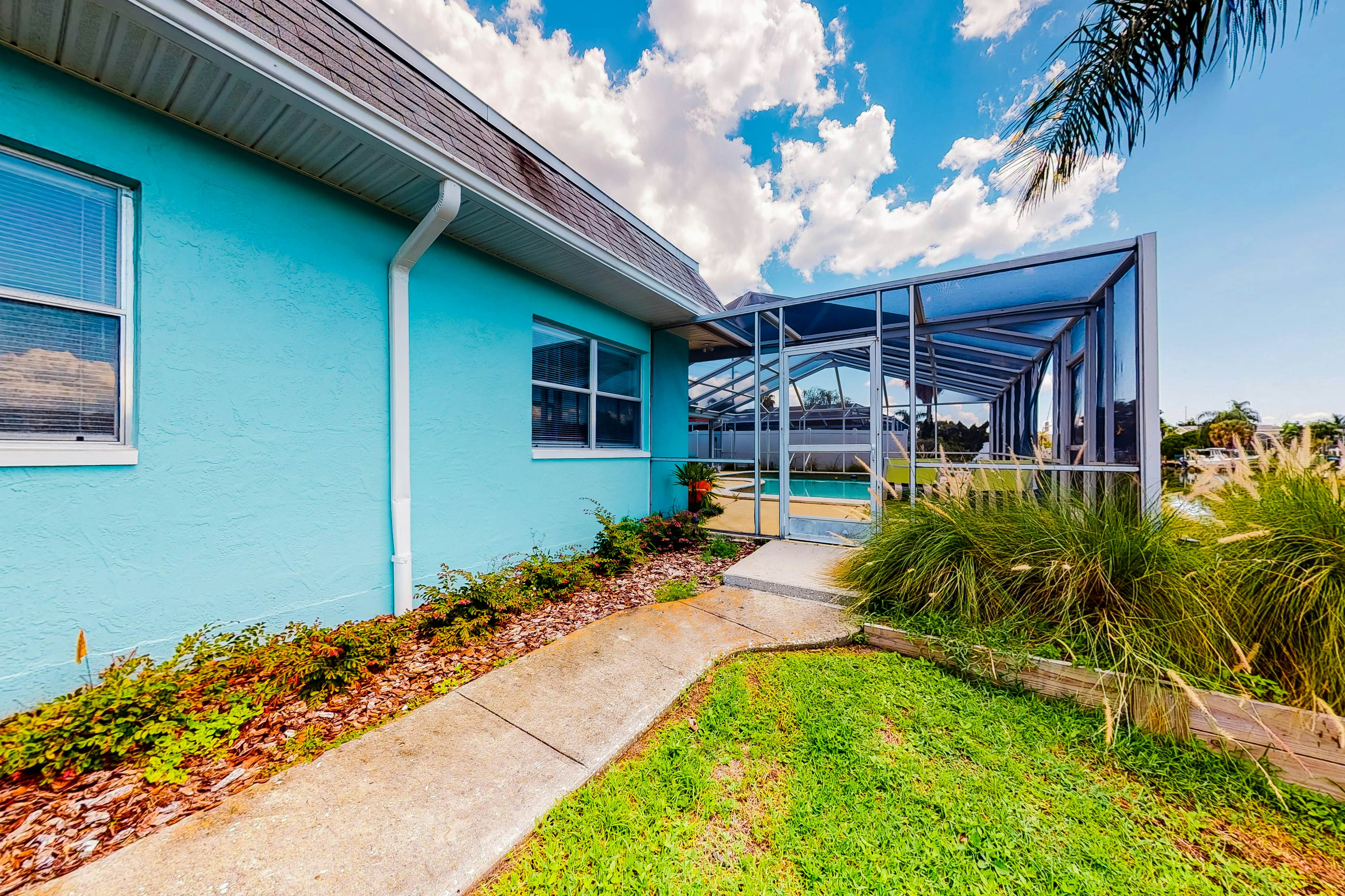 Dog-friendly house with water view, dock, & beach access - snowbirds welcome