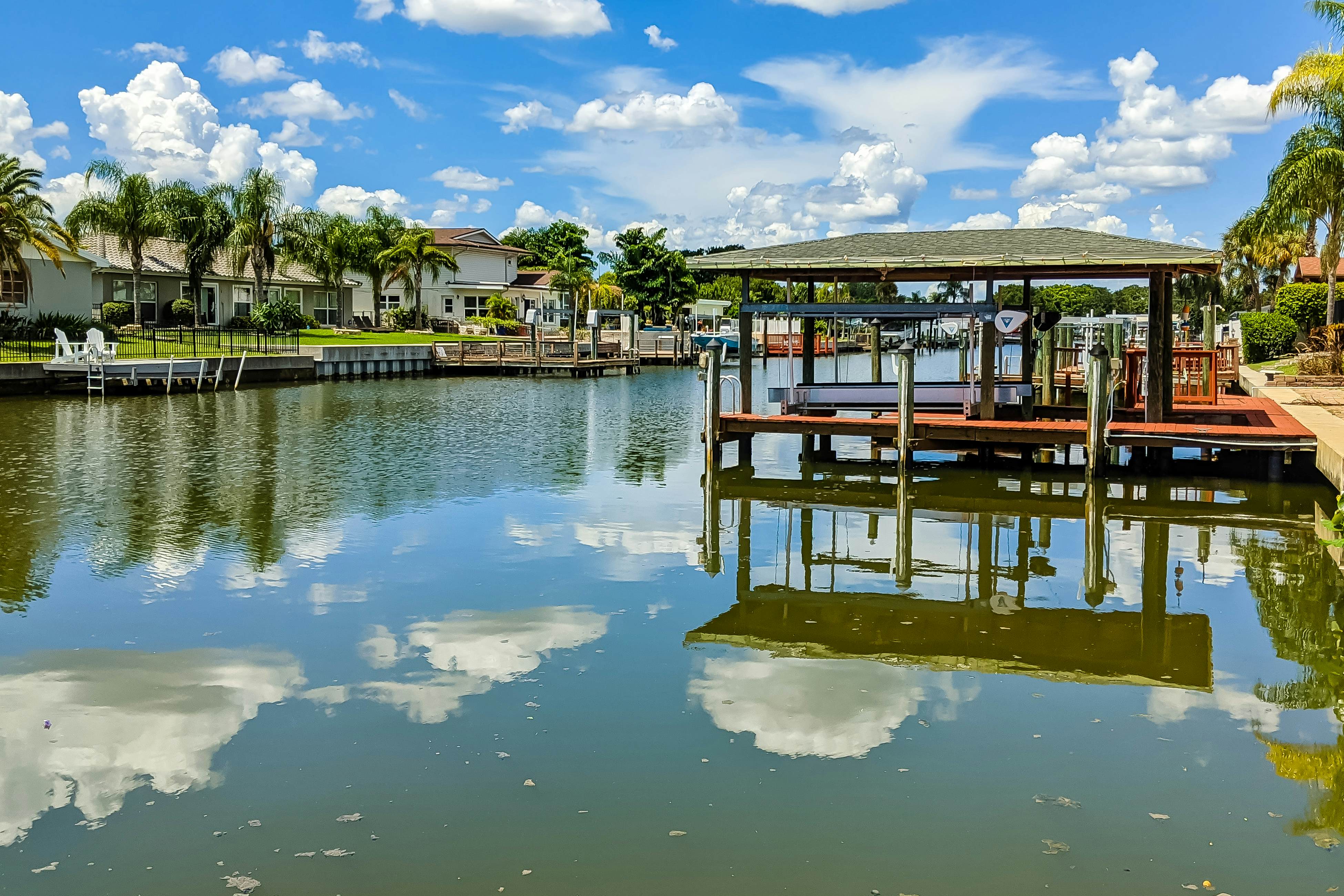 Dog-friendly house with water view, dock, & beach access - snowbirds welcome