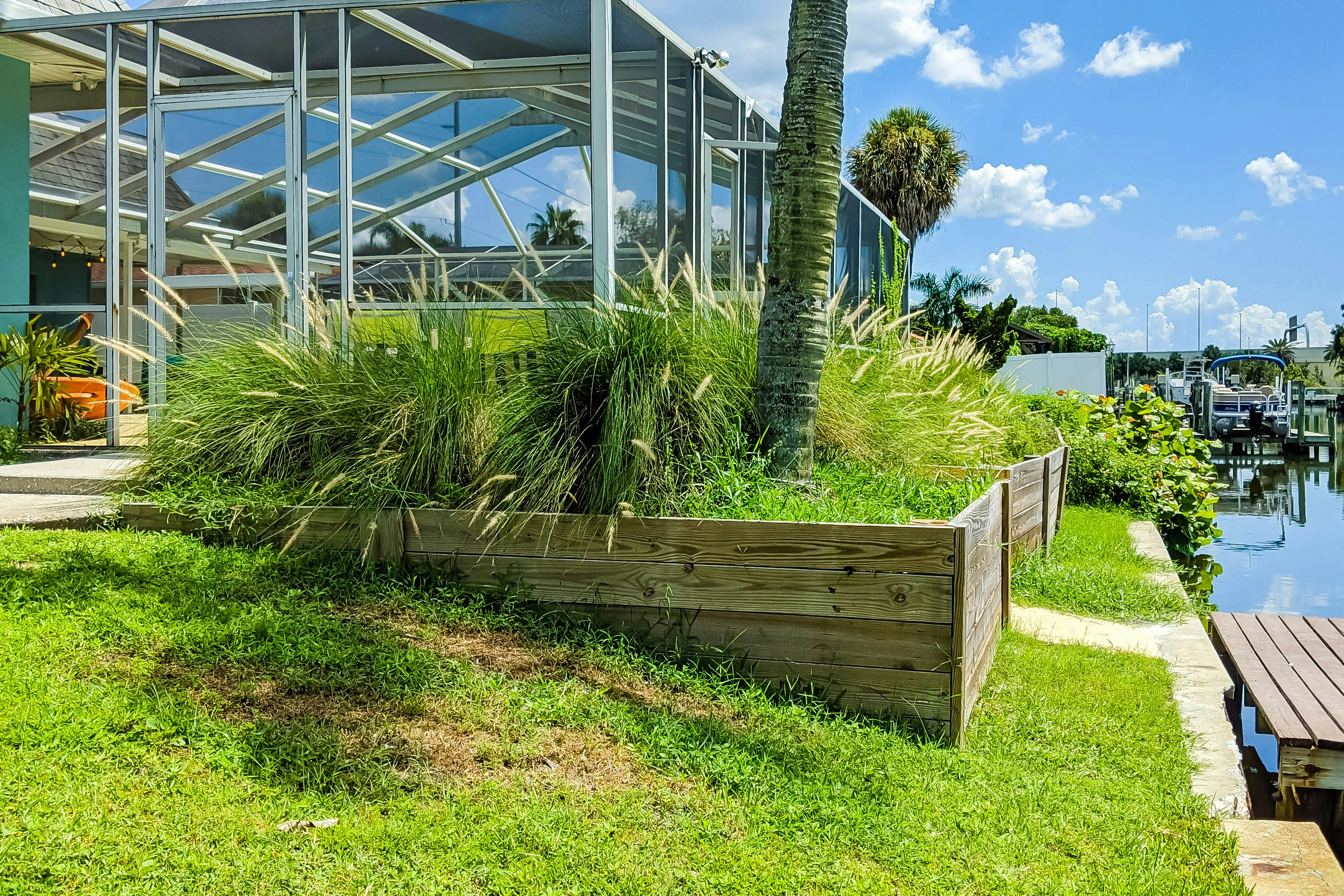 Dog-friendly house with water view, dock, & beach access - snowbirds welcome