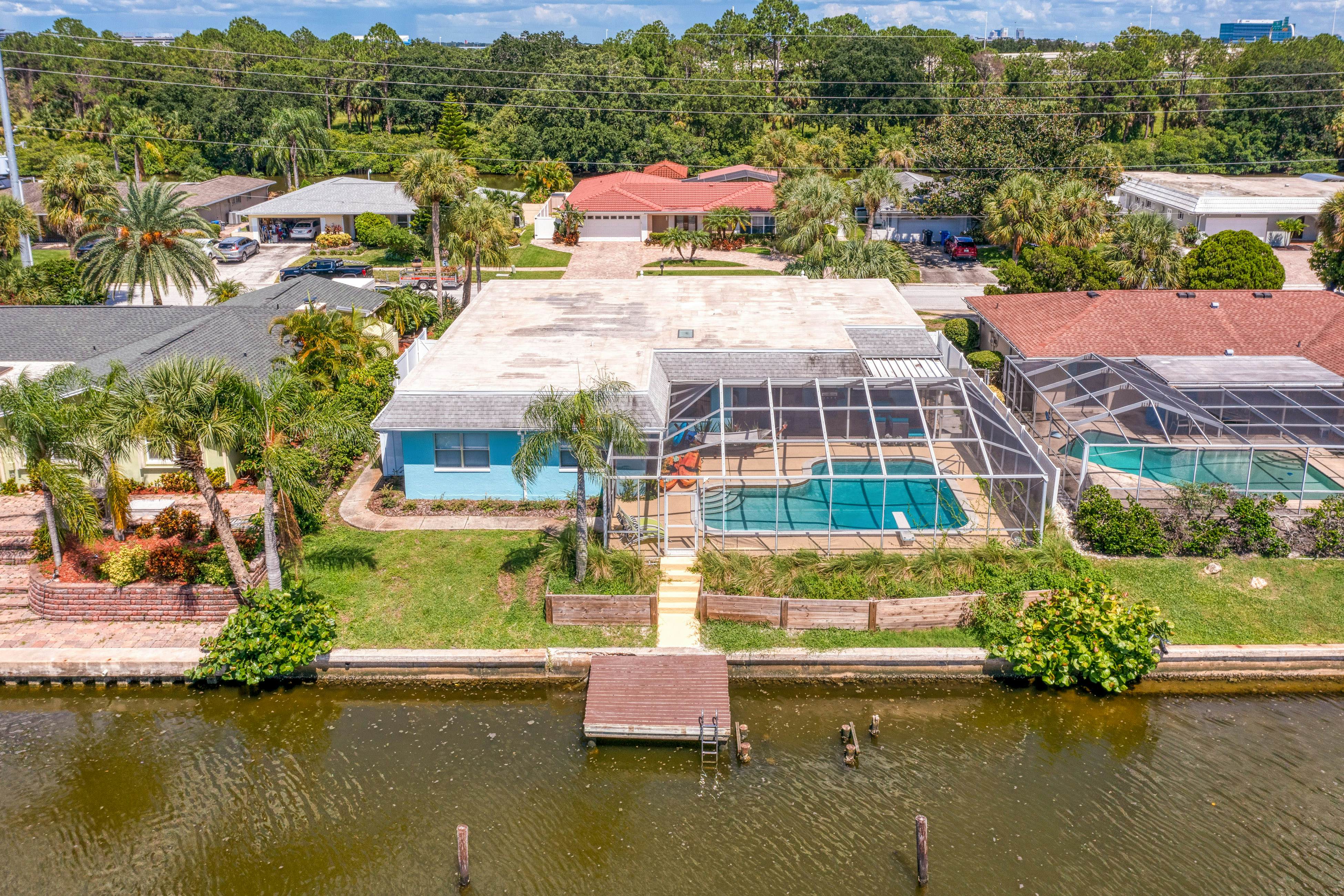 Dog-friendly house with water view, dock, & beach access - snowbirds welcome
