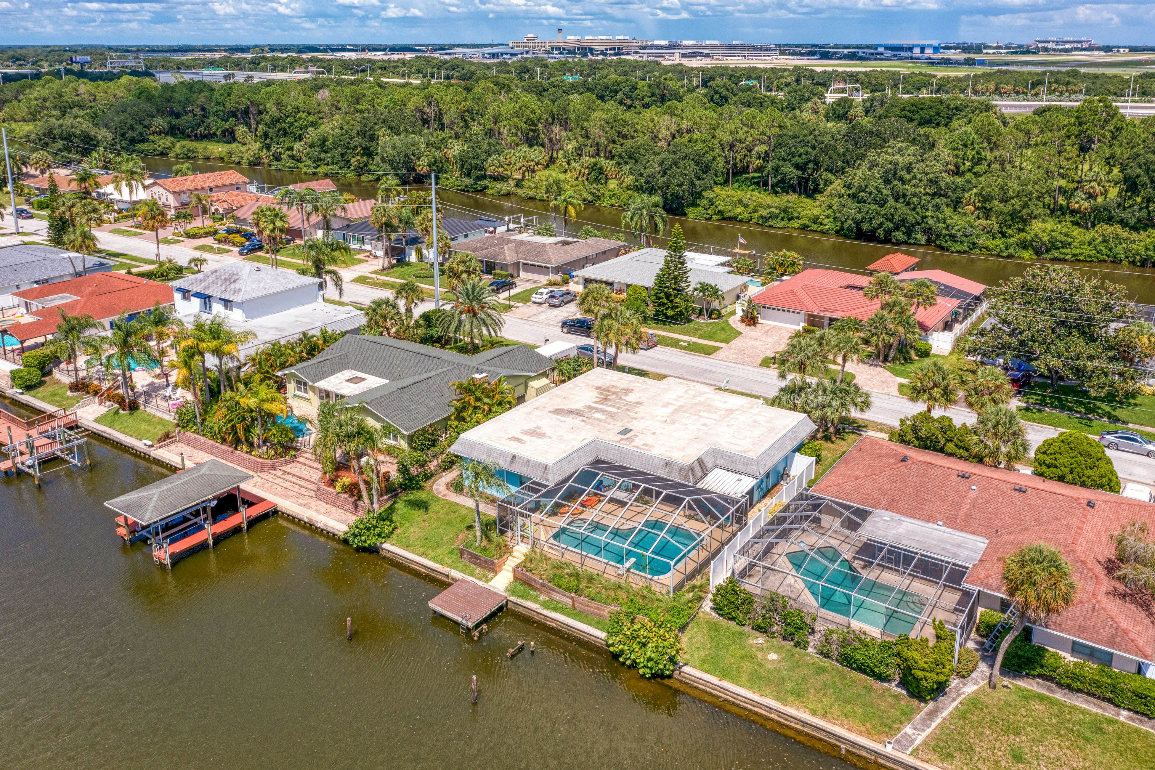 Dog-friendly house with water view, dock, & beach access - snowbirds welcome