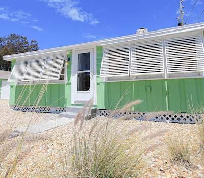 Modern beach getaway steps to beach WD and AC walk to dining