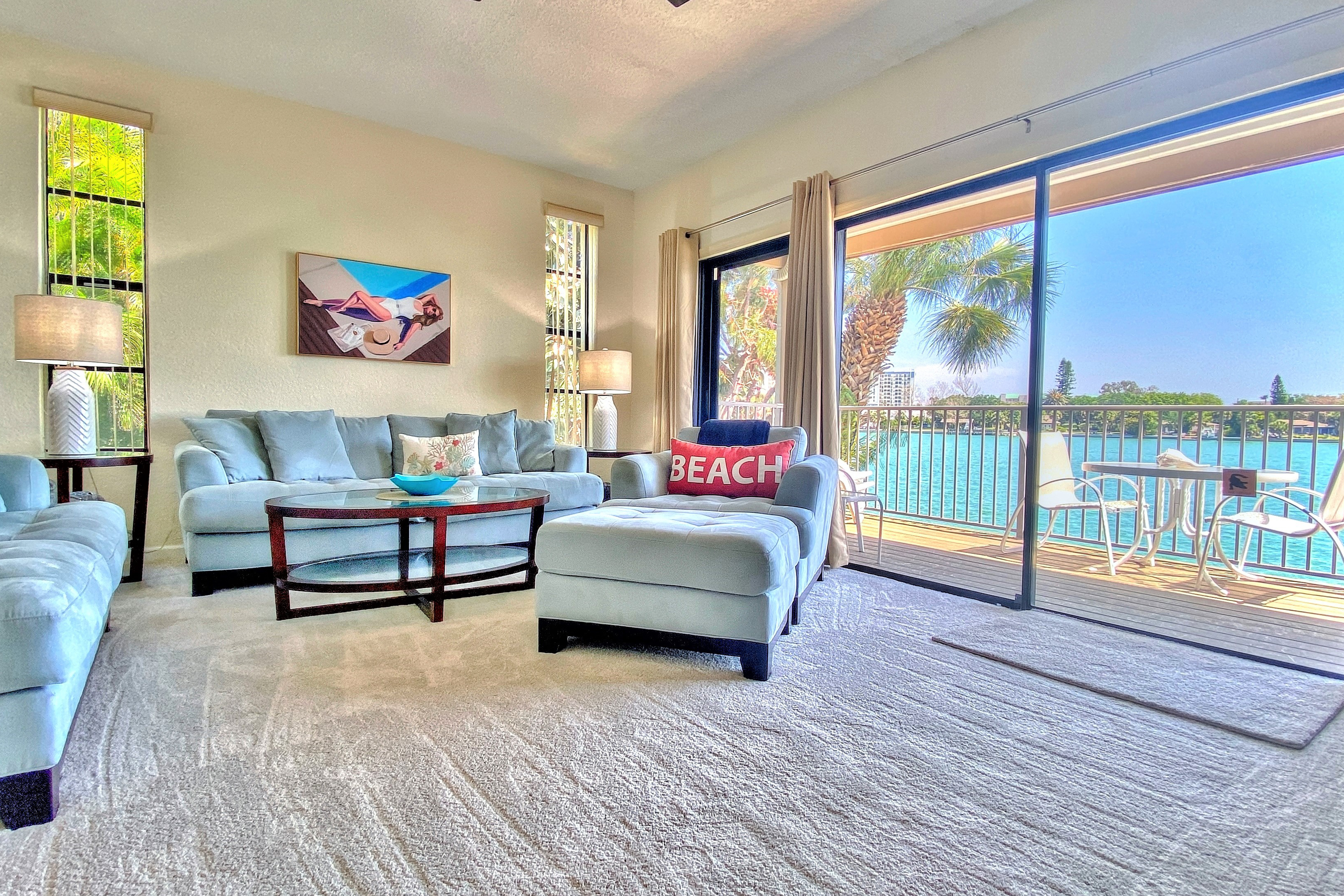 Coastal condo with multiple balconies and dock intracoastal waterway views
