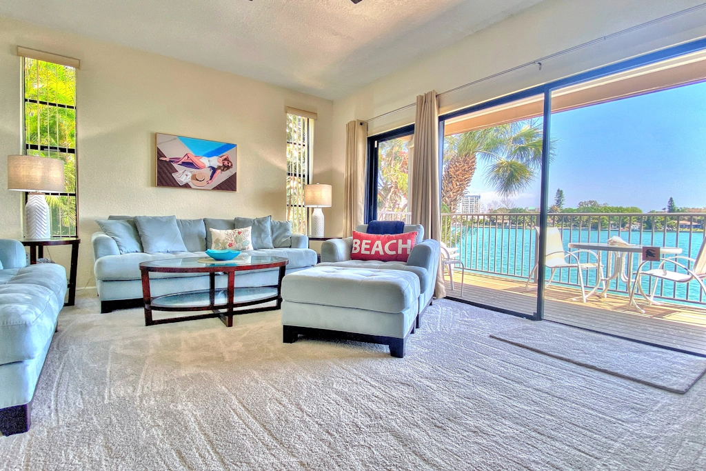 Coastal condo with multiple balconies and dock intracoastal waterway views