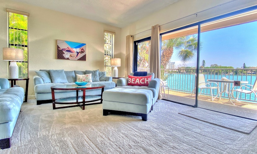 Coastal condo with multiple balconies and dock intracoastal waterway views