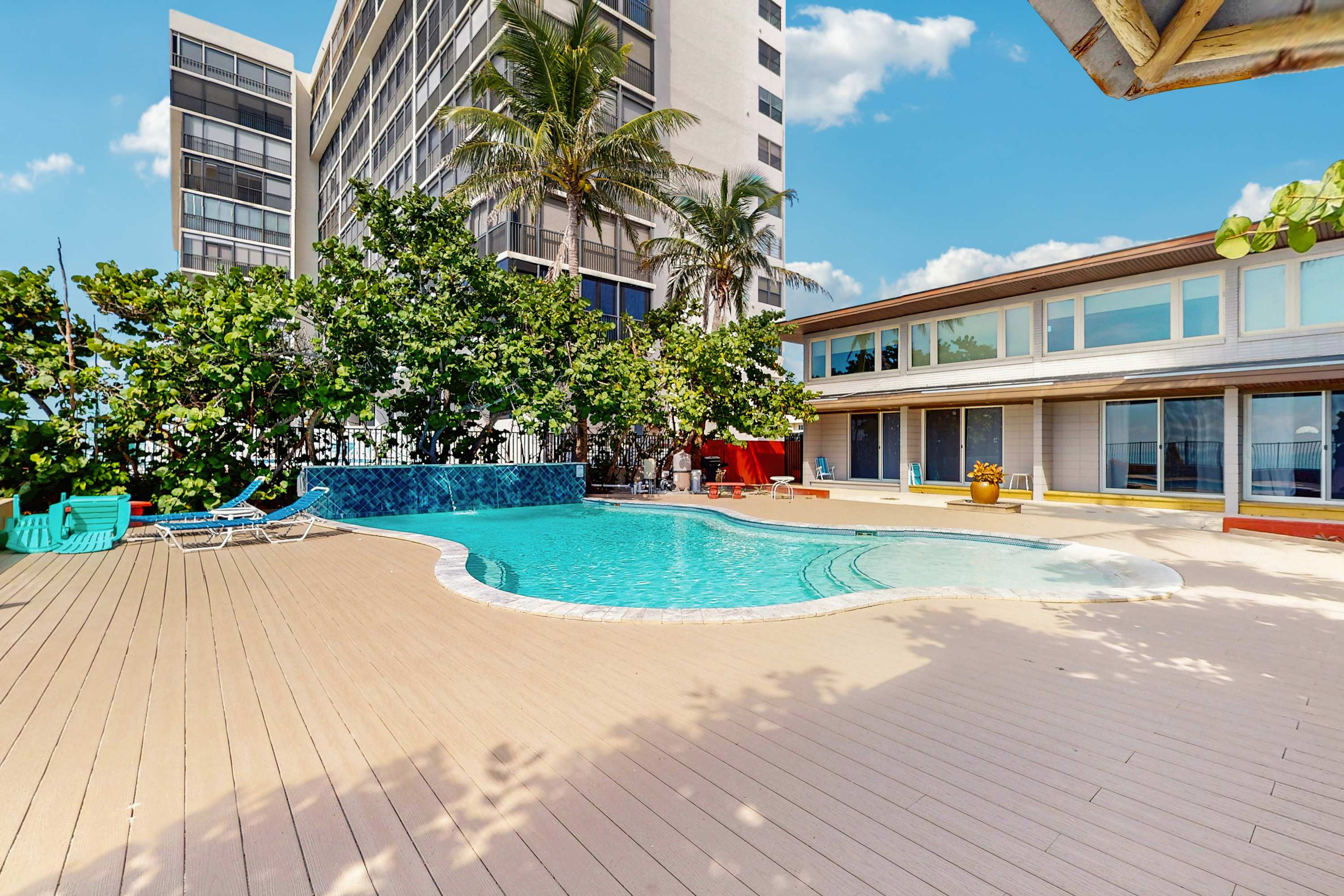 Beachfront condo with pool and island vibes