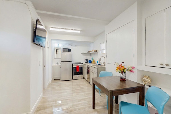 Beachfront condo with pool and island vibes